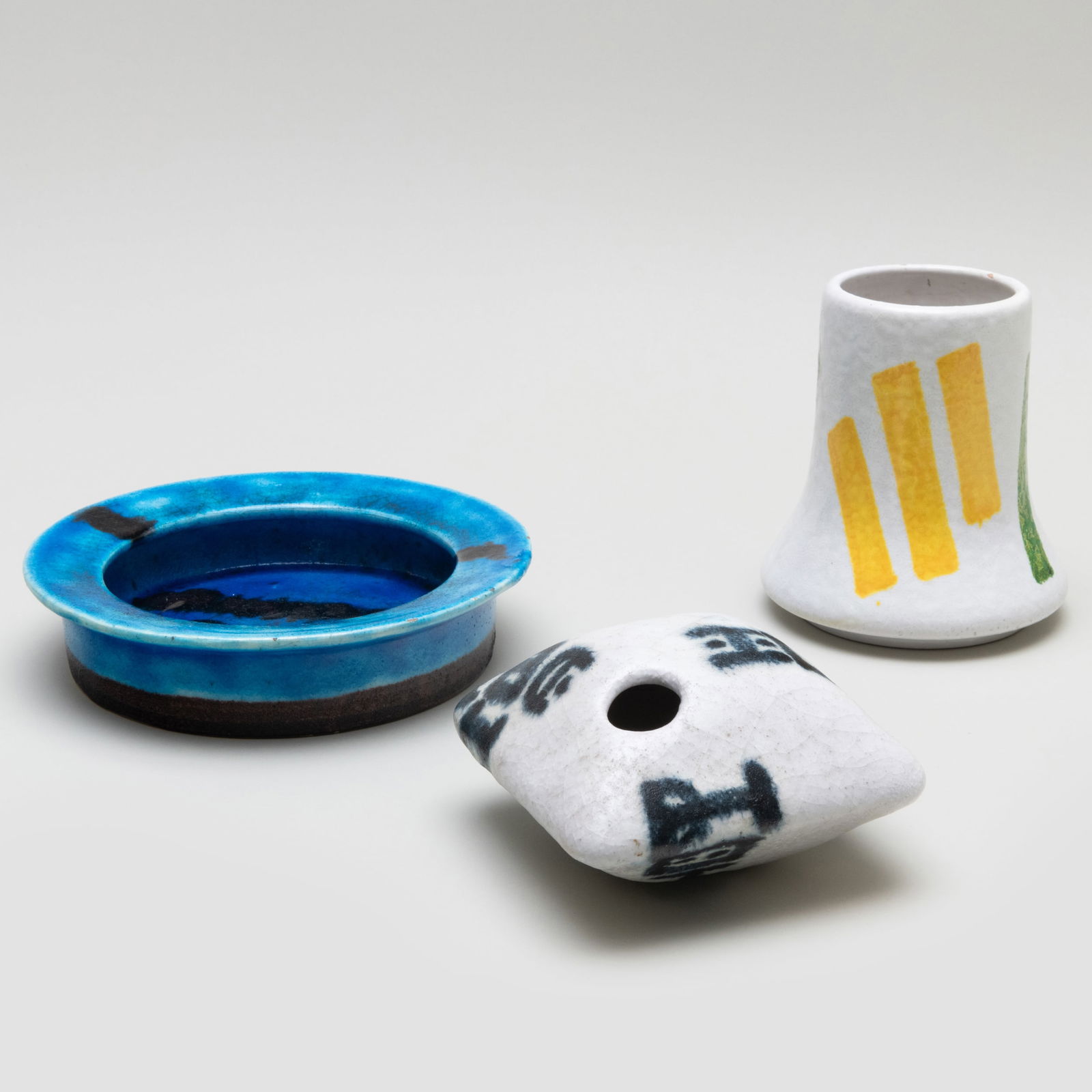 Guido Gambone Glazed Earthenware Dish and Pillow Vase: Guido Gambone Glazed Earthenware Dish and Pillow Vase Two glazed earthenware with black painted mark, with the artist insignia on the bottom; together with a glazed earthenware vase. The pillow vase 3