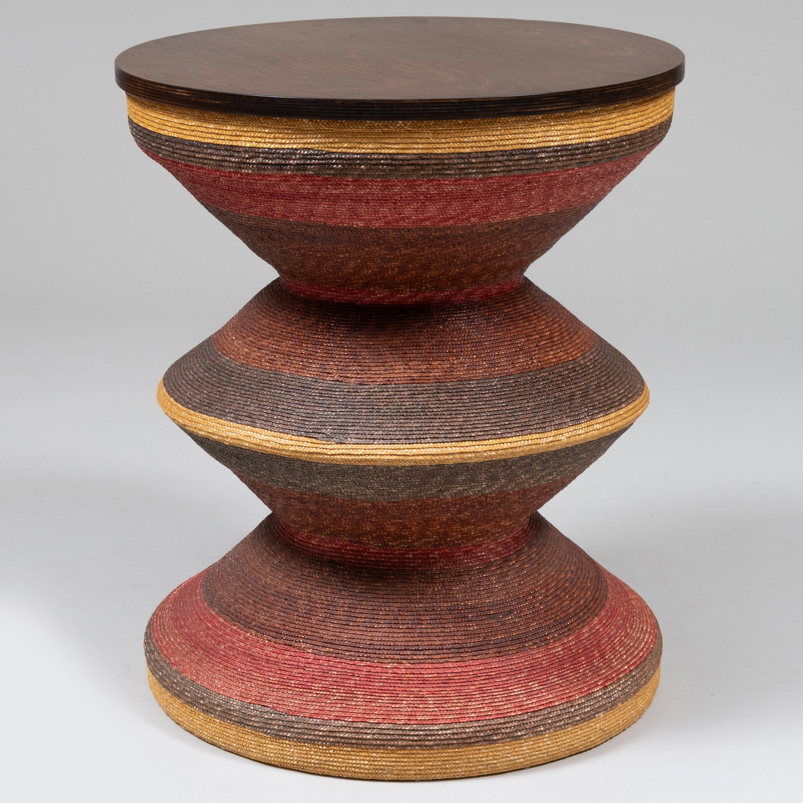 Aleman/Moore Woven Dyed Straw and Stained Russian Birch Plywood 'Maya 24' Side Table: Aleman/Moore Woven Dyed Straw and Stained Russian Birch Plywood 'Maya 24' Side Table Label. 24 x 20 1/2 in. diam. 