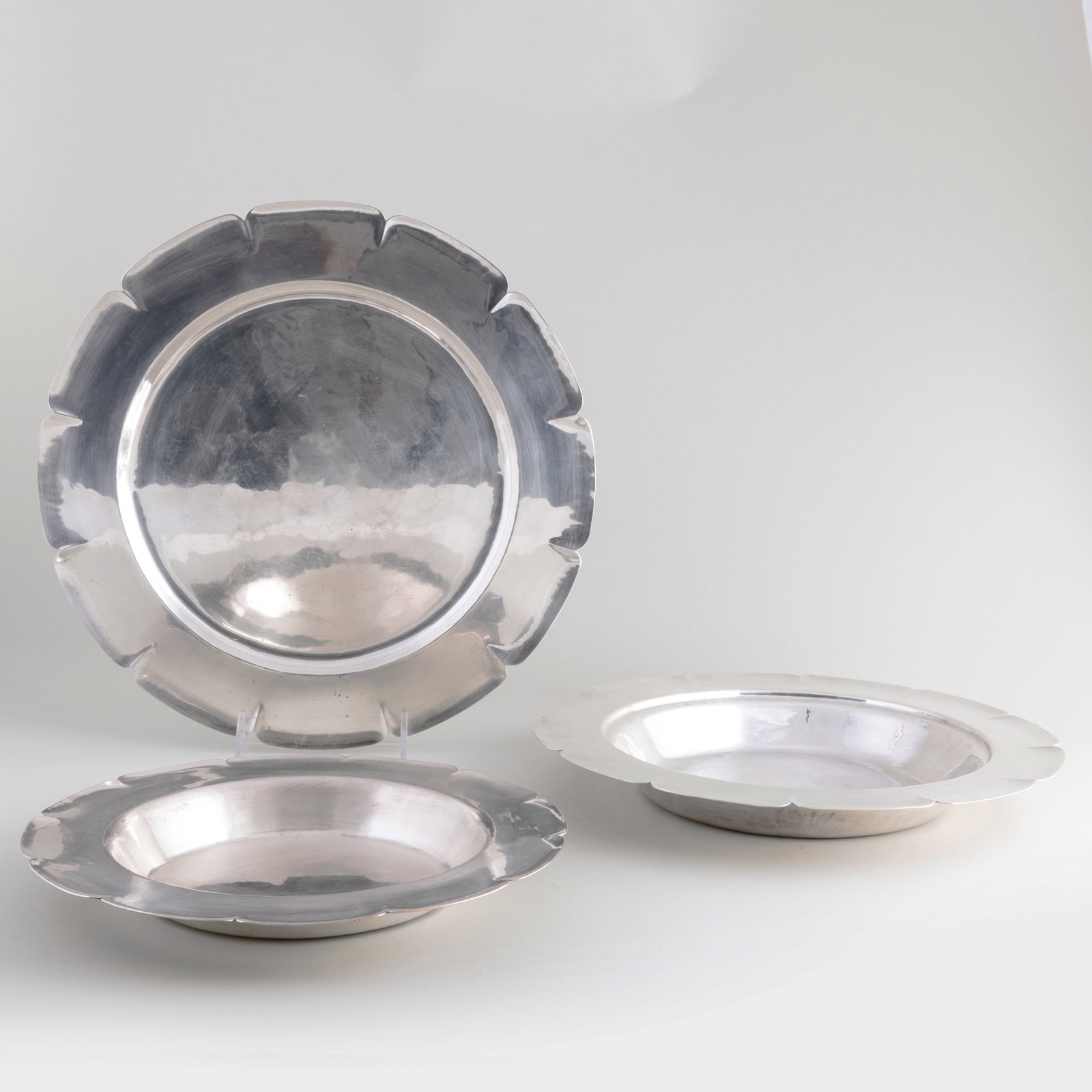 Two Dirk Van Erp Hammered Metal Bowls and a Charger: Two Dirk Van Erp Hammered Metal Bowls and a Charger Stamped mark. The larger bowl 2 x 14 1/2 in. diam., the charger 16 in. diam. Isak Lindenauer Antiques, San Francisco, 1995. The Collection of Ann an