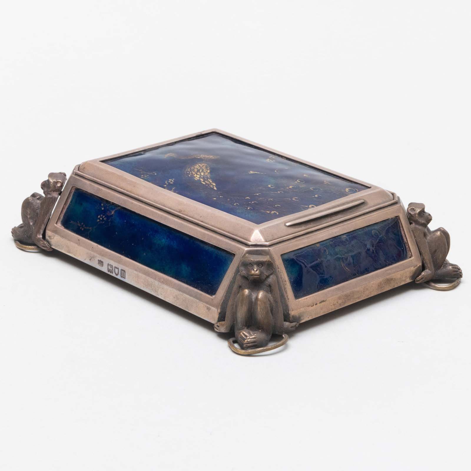 Aesthetic Silver and Enamel Table Box: Aesthetic Silver and Enamel Table Box Marked London, 1908, maker's mark indistinct; decorated with monkey supports and enameled with a peacock. Cedar lining and fitted with mirror.1 1/2 x 6 x 5 in. Sp