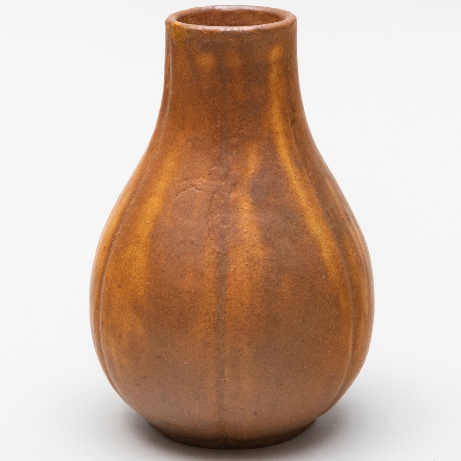 Greuby Faience Company Brown Glazed Pottery Vase: Greuby Faience Company Brown Glazed Pottery Vase Impressed mark and incised monogram for Ruth Erickson. 7 1/4 x 4 1/2 in. diam. The Collection of Ann and Gordon Getty.