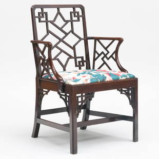 George III Carved Mahogany Fretwork Armchair: George III Carved Mahogany Fretwork Armchair37 x 25 1/4 x 21 in. seat height 20 in.Note: Re-upholstered in a Michael Smith Jasper 'Grace' fabric.Sold Sotheby's, NY, October 3, 2006, Lot 115, as a