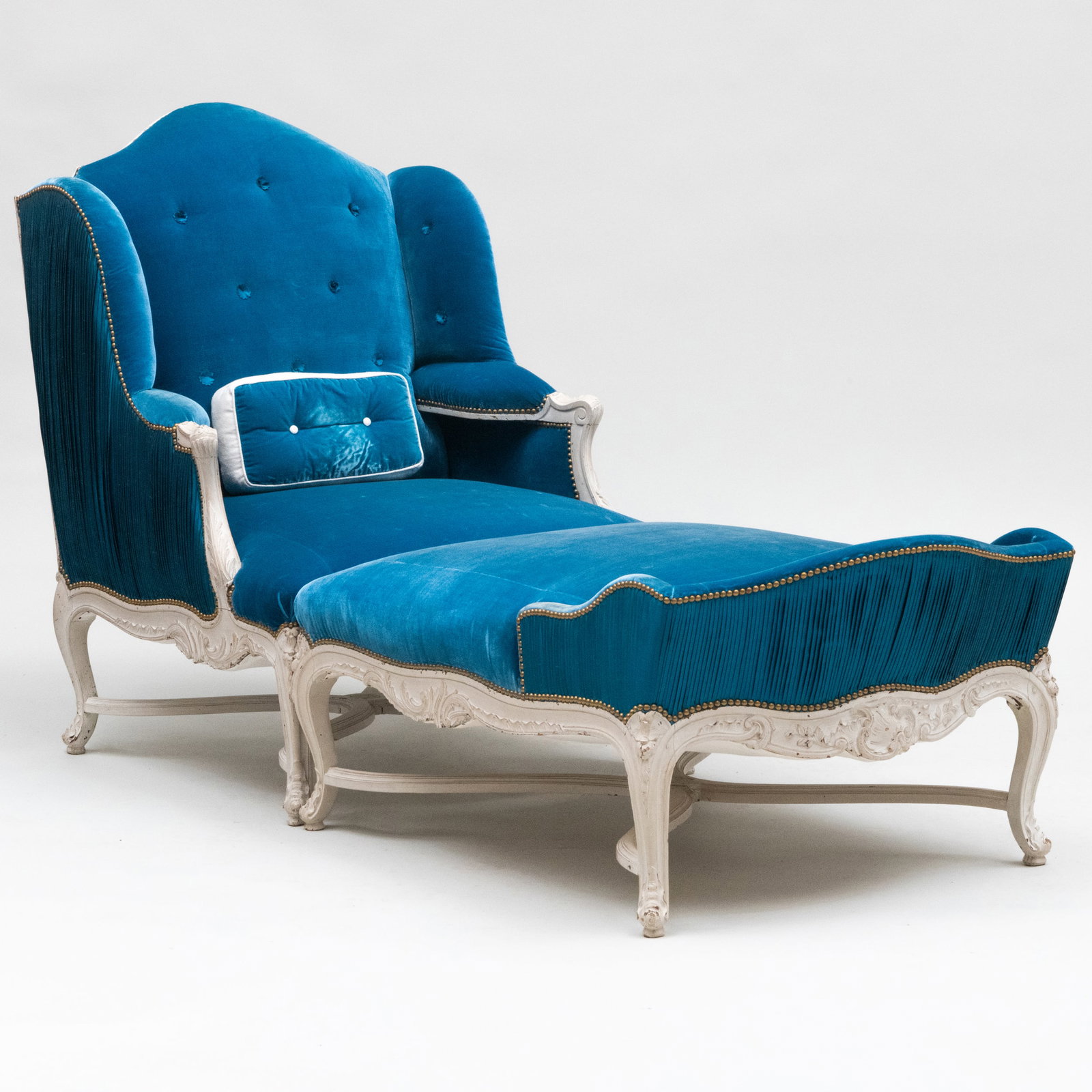 Louis XV Style White Painted and Prelle Blue Velvet Upholstered Duchesse Brisée: Louis XV Style White Painted and Prelle Blue Velvet Upholstered Duchesse Brisée 43 1/2 x 32 x 31 1/2 in., seat height 16 1/2 in. (the armchair). 20 3/4 x 30 1/2 x 40 in. (the ottoman). The Collec