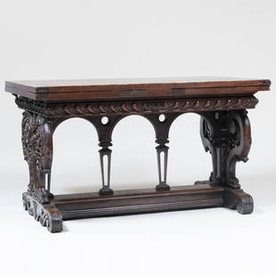 Renaissance Revival Stained and Carved Walnut Extending Library Table: Renaissance Revival Stained and Carved Walnut Extending Library TableStamped in four places with an anchor and the initials 'F B W'. 33 1/2 in. x 4 ft. 9 3/4 in.