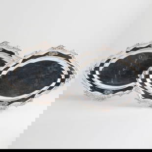 Pair of George III Silver Oval Meat Platters: Pair of George III Silver Oval Meat Platters Mark of William Grundy, London, 1767; engraved with crest. 10 1/4 x 13 3/4 in., 46.3 oz. approx. weight. Sotheby's, London, November 12, 1998, Lot 130 The