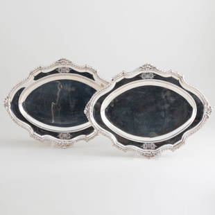 Pair of George III Silver Oval Meat Platters: Pair of George III Silver Oval Meat Platters Mark of William Grundy, London, 1767; engraved with crest. 10 1/4 x 13 3/4 in., 46.3 oz. approx. weight. Sotheby's, London, November 12, 1998, Lot 130 The