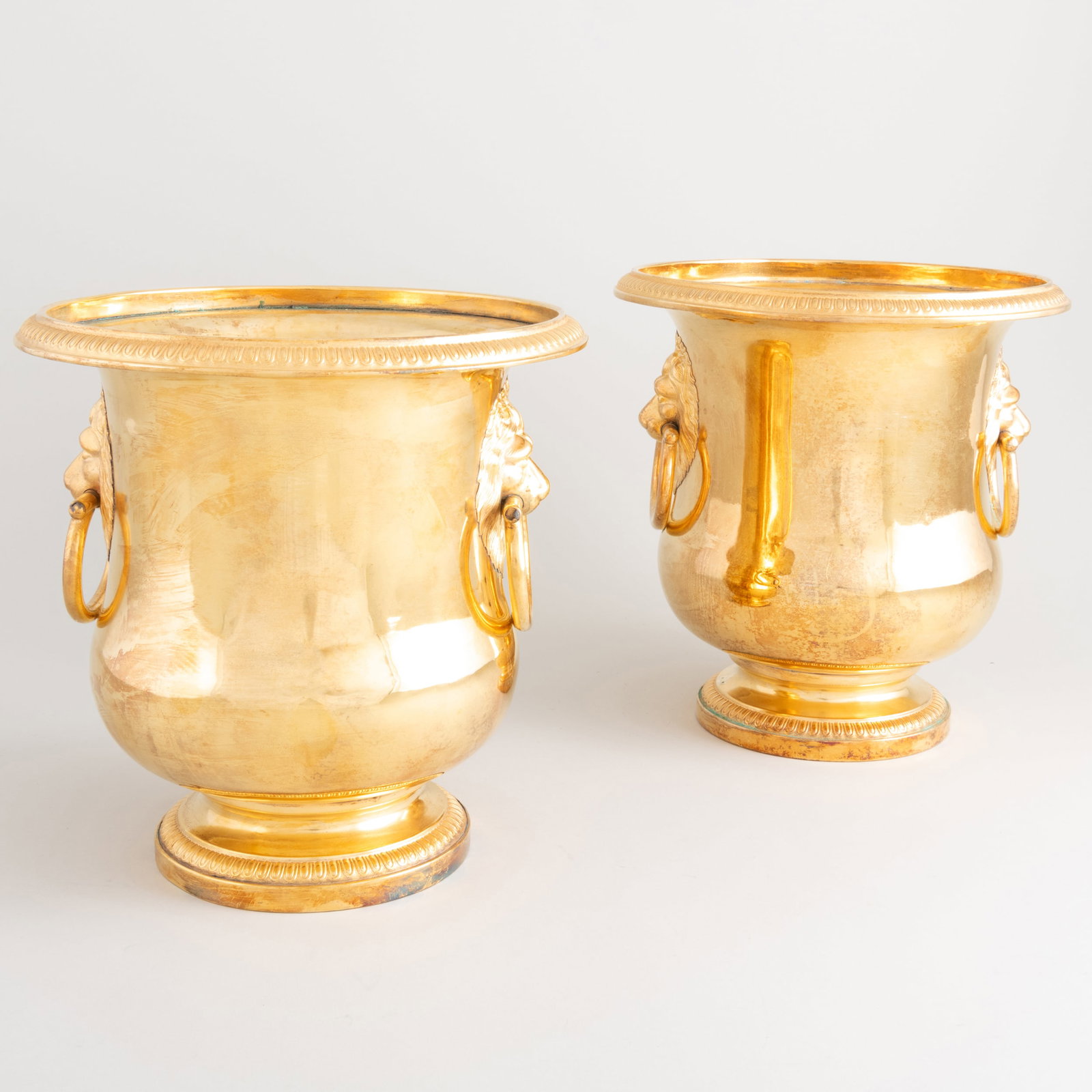 Pair of French Gilt-Metal Wine Coolers with Lion Mask Handles: Pair of French Gilt-Metal Wine Coolers with Lion Mask Handles 8 x 7 3/4 in. diam. The Collection of Jordan Saunders.
