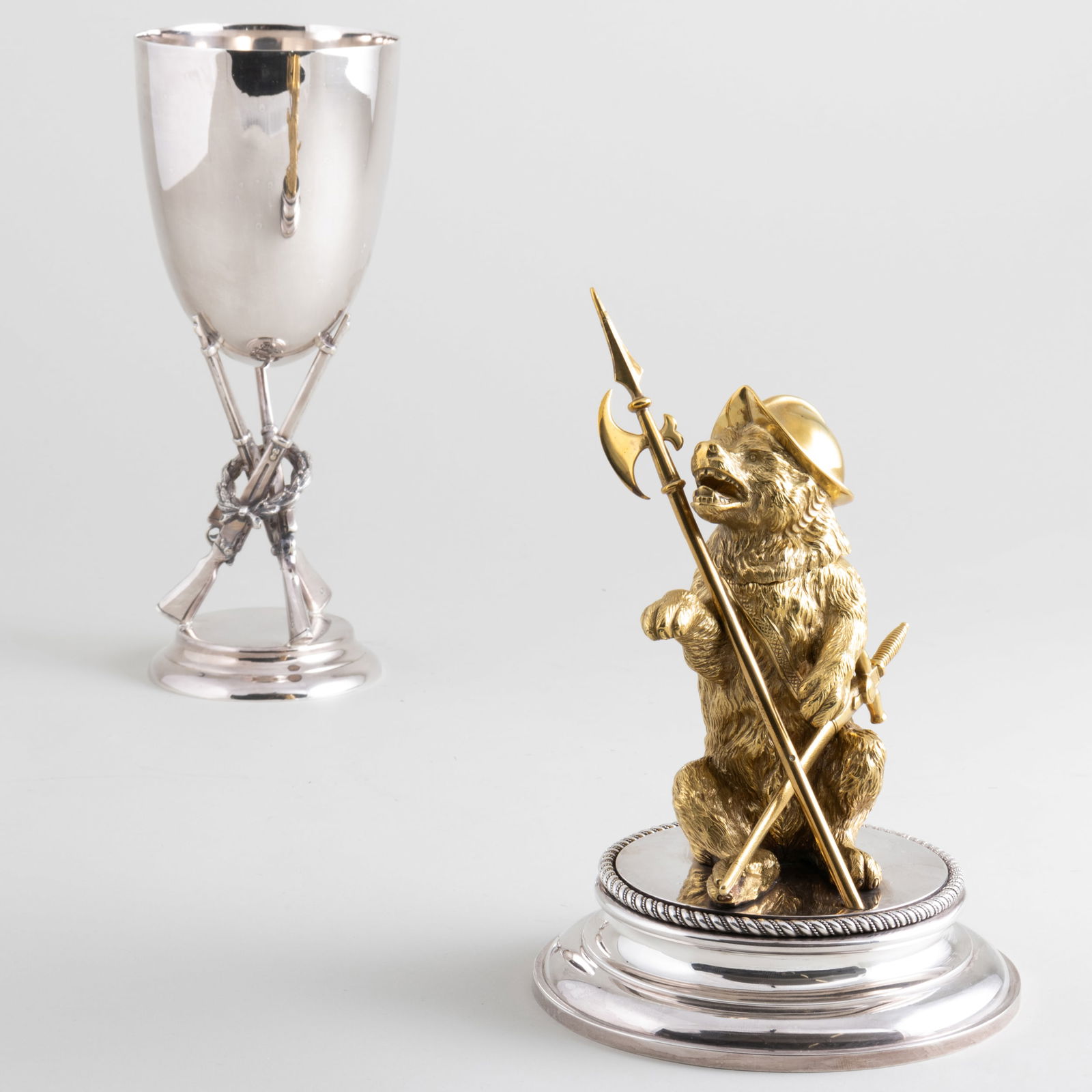 Mappin & Webb Silver Plate Goblet with Rifle Supports and a Bear Form Inkwell with Sword and Halberd: Mappin & Webb Silver Plate Goblet with Rifle Supports and a Bear Form Inkwell with Sword and Halberd The inkwell with porcelain liner. The goblet 9 1/4 x 3 3/4 in. diam., the inkwell 9 x 5 1/2 in. dia