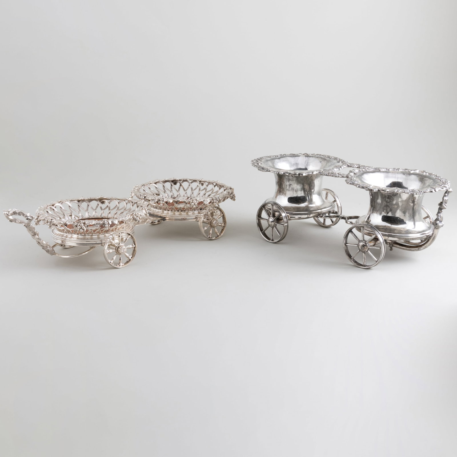 Elkington & Co. Silver Plate Wine Trolley and Another Silver Plate Wine Trolley: Elkington & Co. Silver Plate Wine Trolley and Another Silver Plate Wine Trolley The Elkington 5 x 18 1/2 x 8 in., the other 5 1/2 x 15 1/4 x 7 in. The Collection of Jordan Saunders.