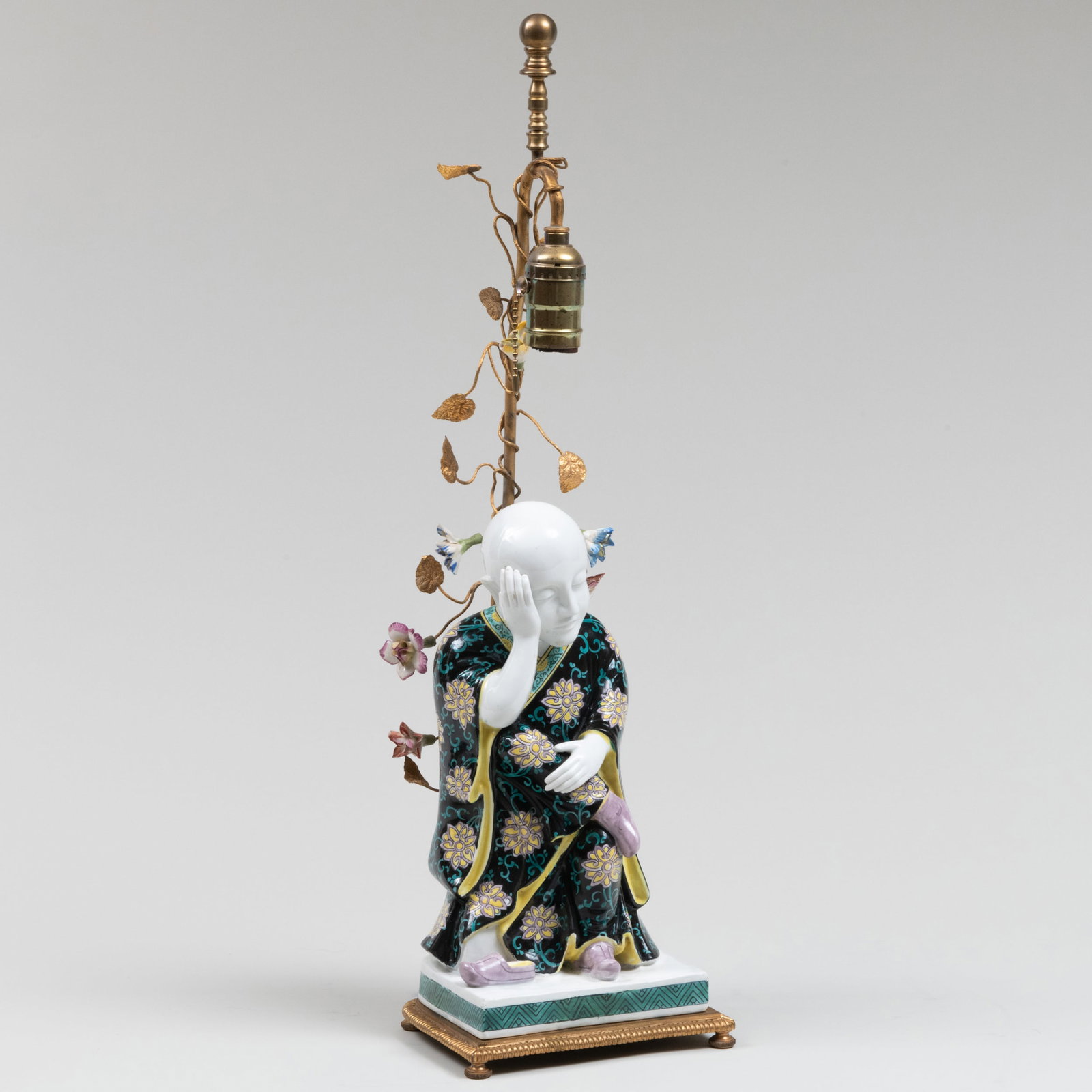 French Famille Noire Porcelain Figure of a Luohan Mounted as a Lamp: French Famille Noire Porcelain Figure of a Luohan Mounted as a Lamp Iron red script 'Made in France' to the reverse. 19 x 7 x 4 1/2 in. (to socket). The Collection of Jordan Saunders.