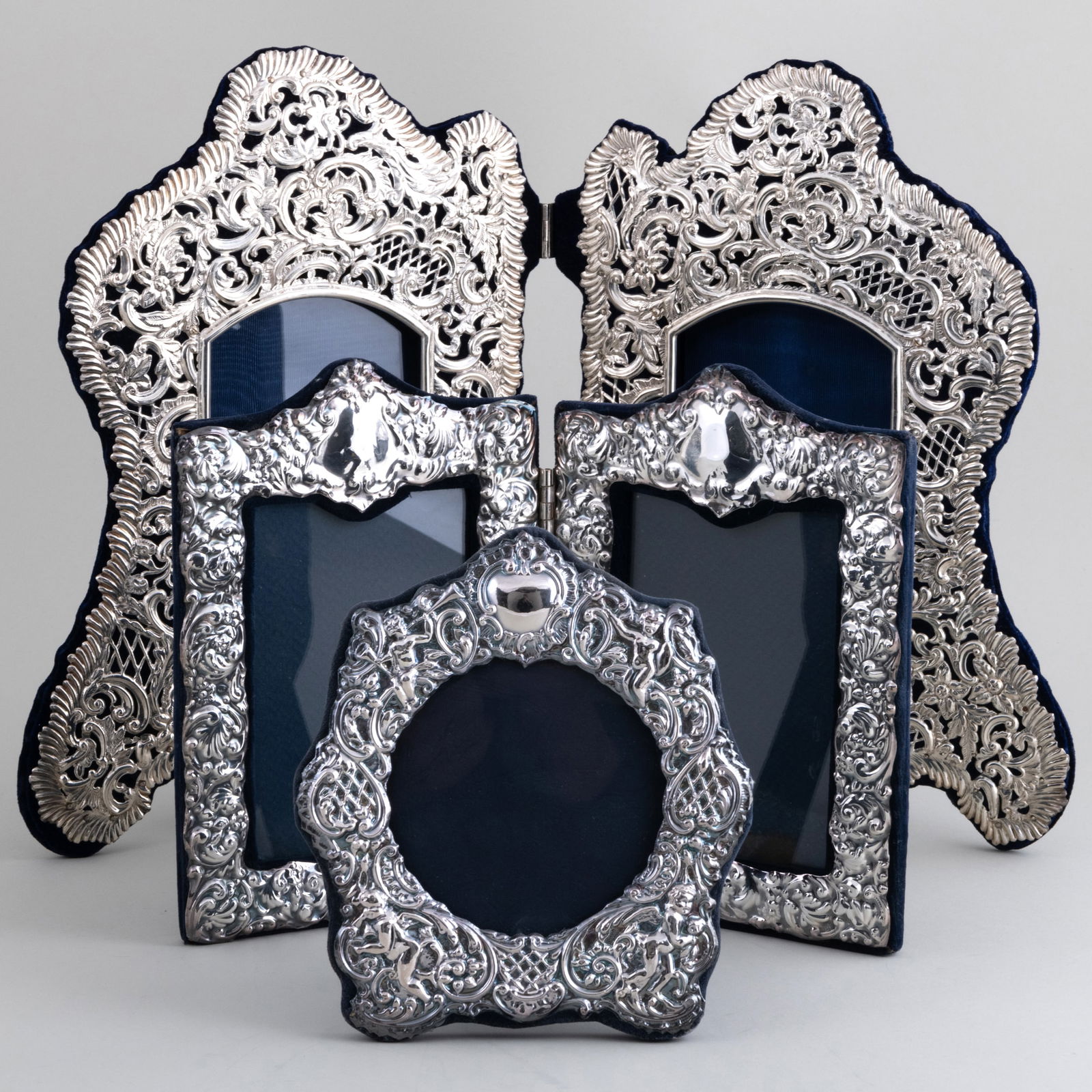 Group of English Silver Picture Frames: Group of English Silver Picture Frames Comprising: A pair of rectangular double frame, marked London, 1984 A large shaped double frame, apparently unmarked A set of three circular frames, apparently u