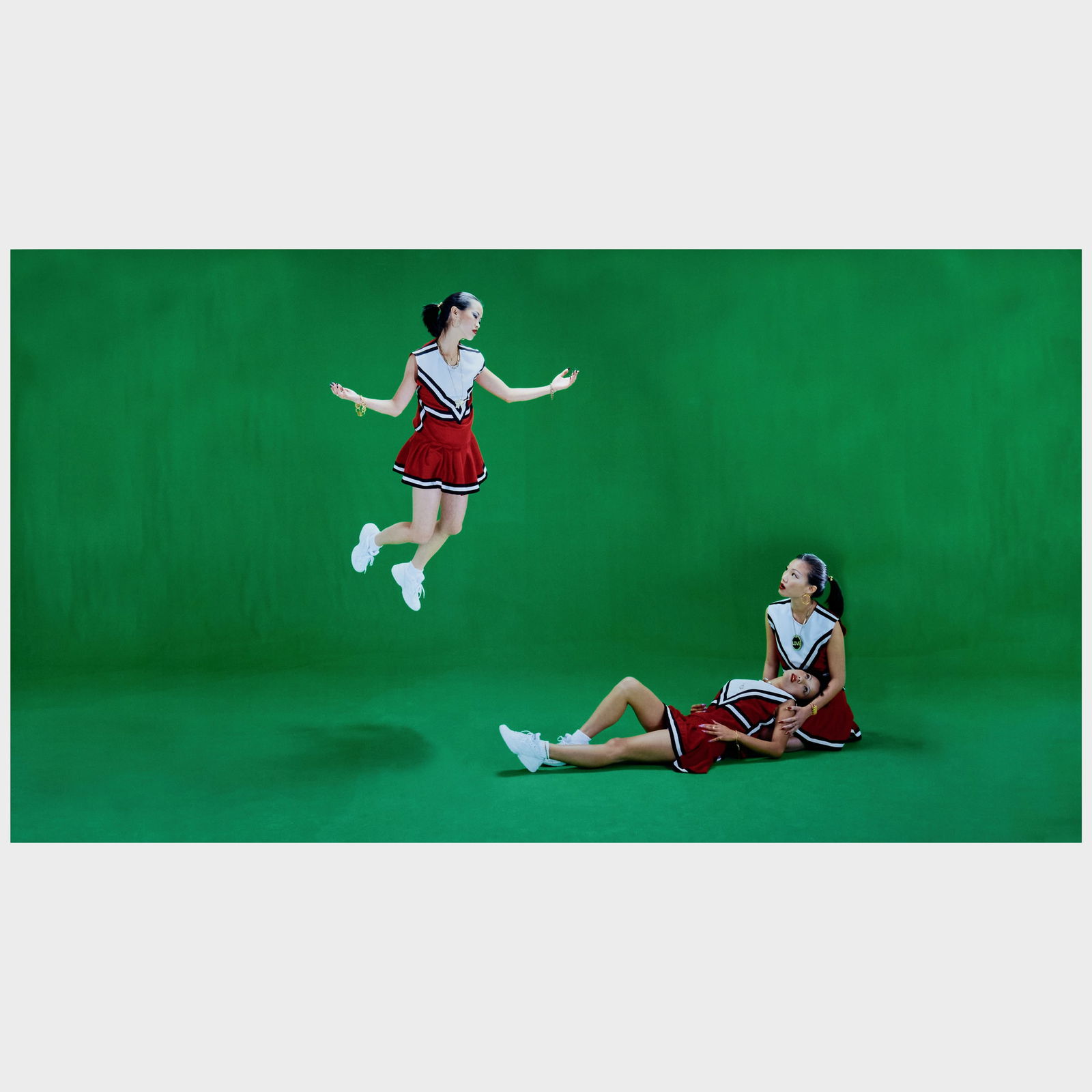 Luis Gispert (b. 1972): Untitled (Three Cheer Leaders) (1 of 3)