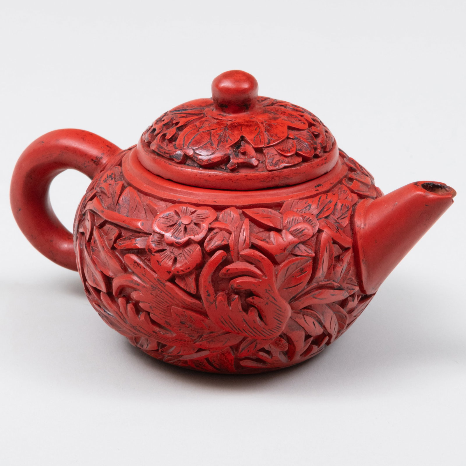 Chinese Yixing Lacquered Pottery Teapot and Cover: Chinese Yixing Lacquered Pottery Teapot and Cover Unmarked. 3 1/4 x 5 1/2 x 4 in. Property from the Collections of Loyd F. and Linda F. Crawley