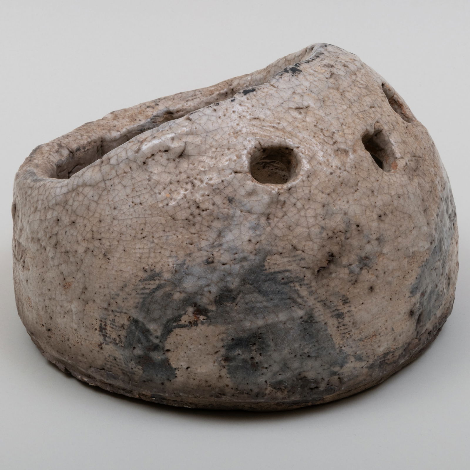 Japanese Shino Earthenware Handwarmer: Japanese Shino Earthenware Handwarmer 7 x 11 x 10 in. McMullen's Japanese Antiques, Ventura, CA, 1997. The Collection of Gordon and Zanne Stewart.