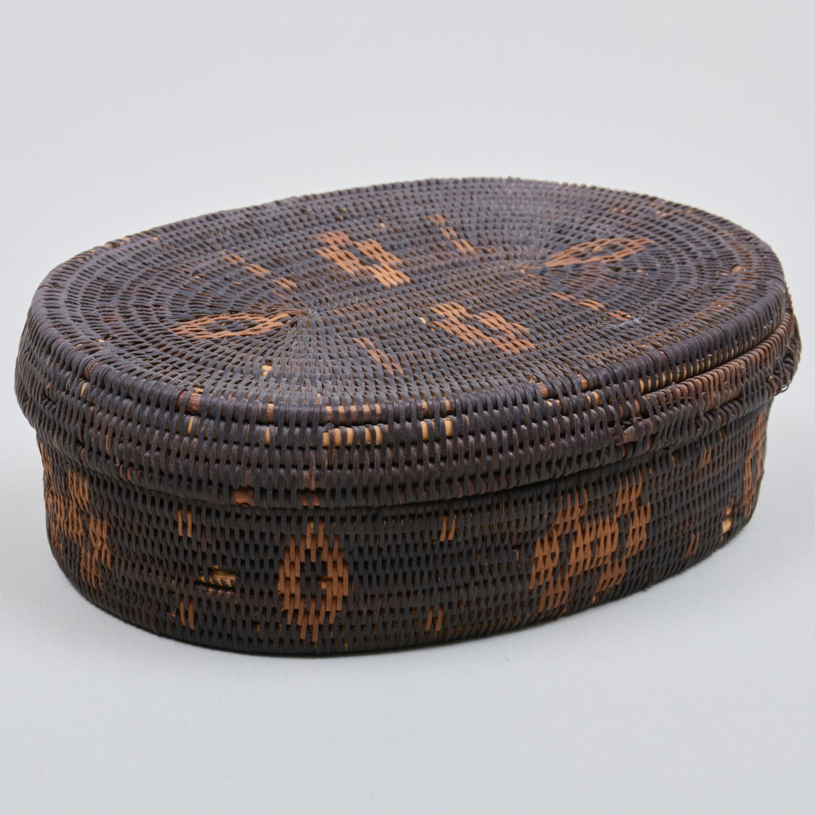 Pueblo Oval Basket and Lid: Pueblo Oval Basket and Lid 1 3/4 x 5 1/4 x 4 in.