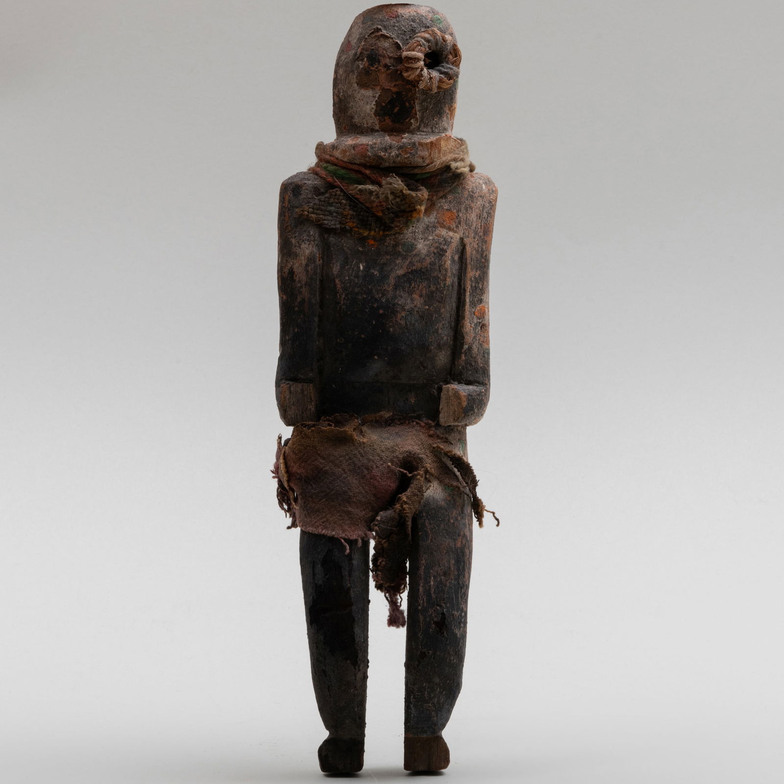 Painted Wood and Fabric Katsina Doll: Painted Wood and Fabric Katsina Doll 12 x 3 1/2 x 2 in. The Collection of Gordon and Zanne Stewart.