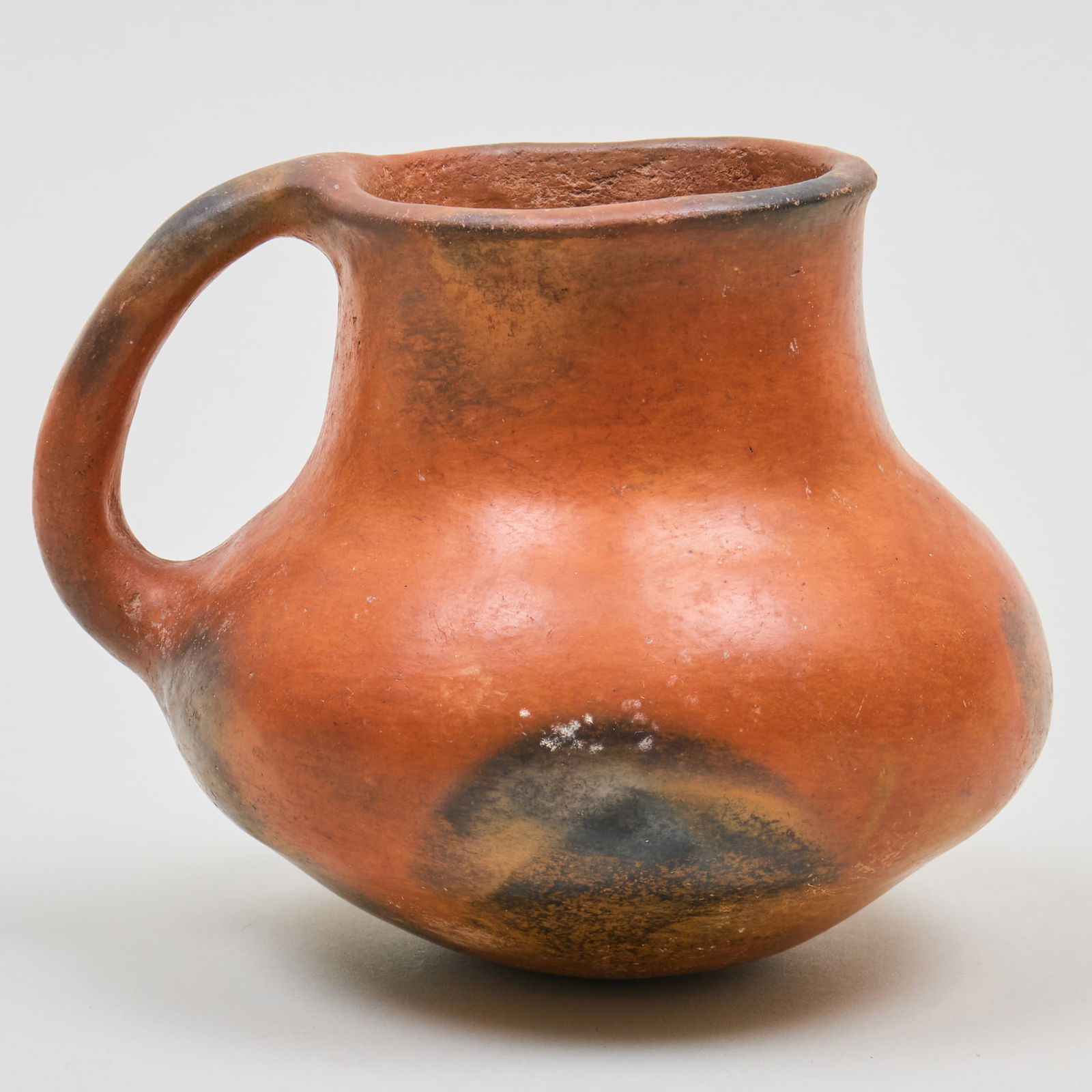 Perry Mesa Salado Redware Jug with Handle: Perry Mesa Salado Redware Jug with Handle 4 3/4 x 6 x 5 in. By repute Gene Lang, Littleton, CO, 1995. The Collection of Gordon and Zanne Stewart.