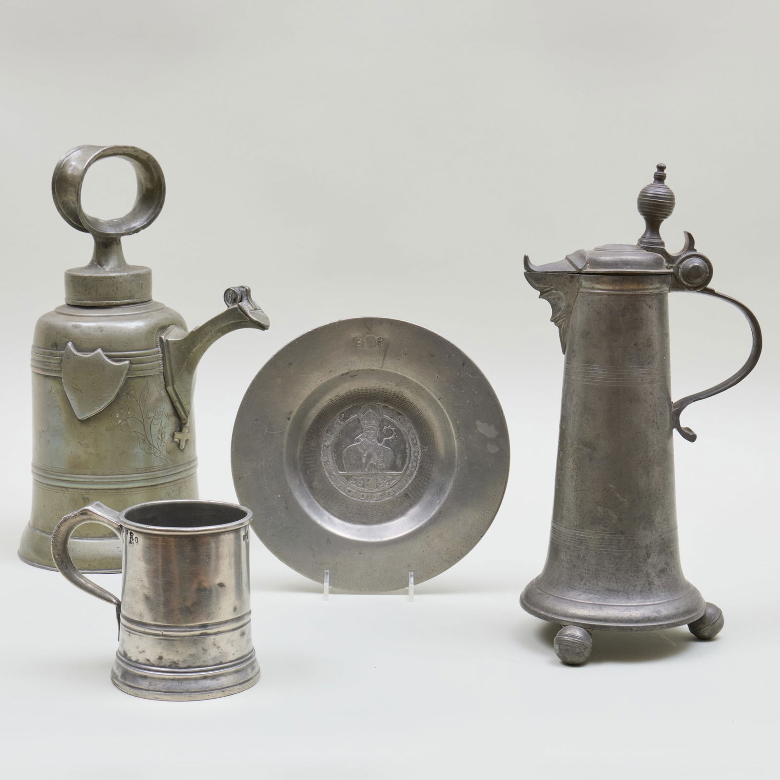 Group of Pewter Wares, Some Possibly Dutch: Group of Pewter Wares, Some Possibly Dutch Comprising: A plate with Latin inscription and '1647', stamped marks An ewer with hinged cover, monogrammed and inscribed '1757' An ewer with ring handle wit