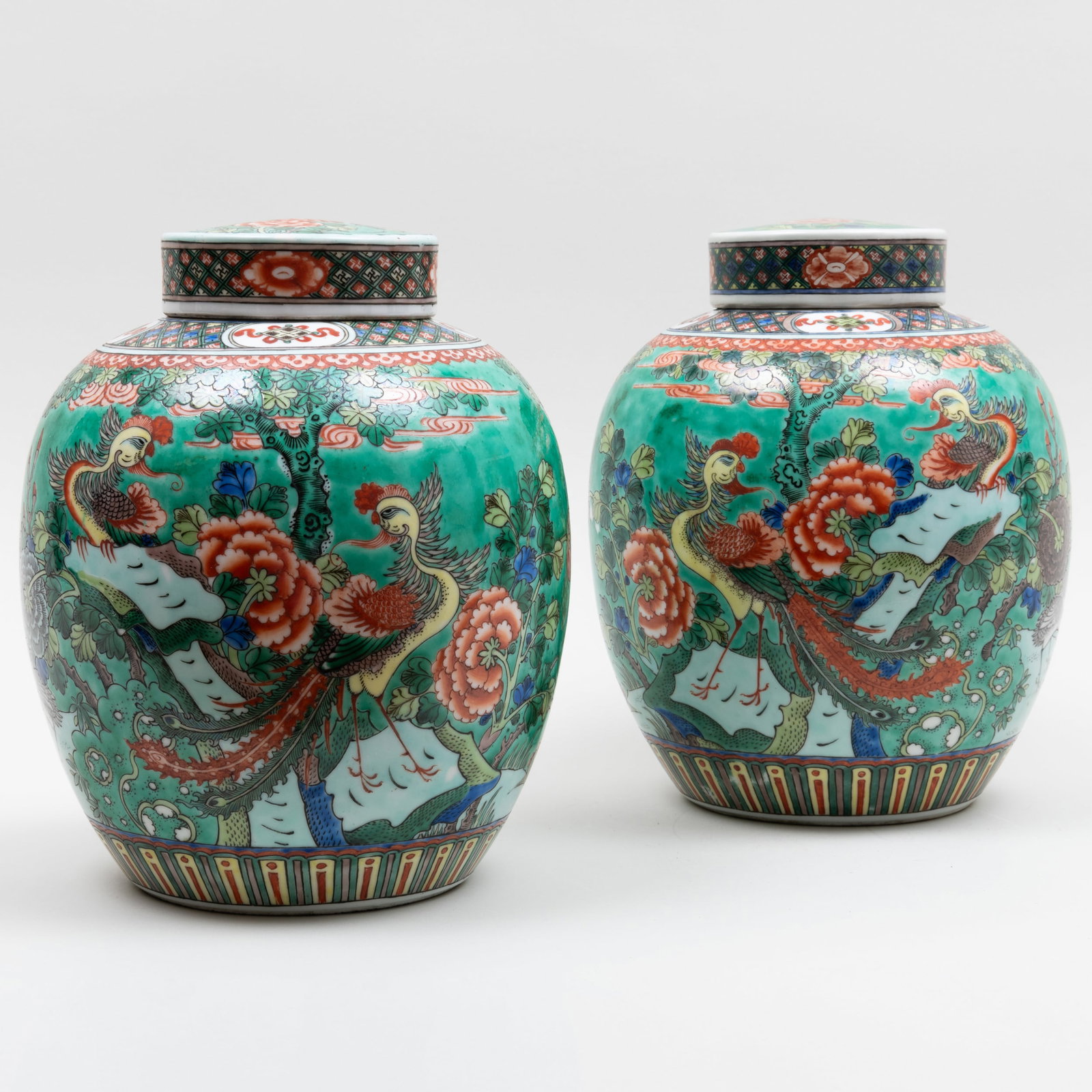 Pair of Famille Verte Porcelain Ginger Jars and Covers: Pair of Famille Verte Porcelain Ginger Jars and Covers Blue double circle mark. 11 x 8 in. diam. Applied label for Gracie & Co., NY, April, 1990, no. A-3043/2.