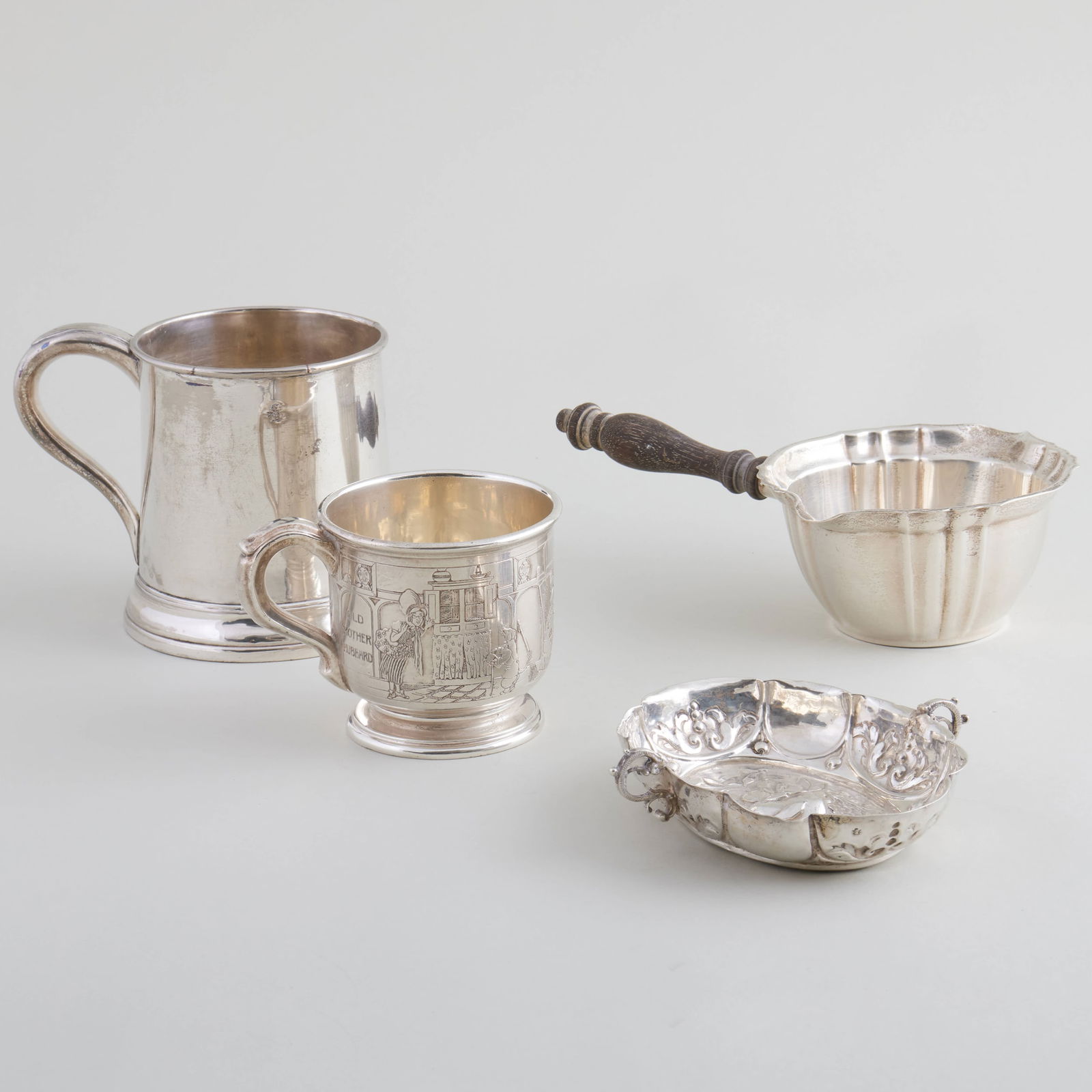 Group of Silver Drinkware: Group of Silver Drinkware Comprising: A Gorham brandy warmer, marked 'Sterling' A Grogan Co. child's mug, marked 'Sterling' A Continental silver wine taster, indistinctly marked Together with a silver