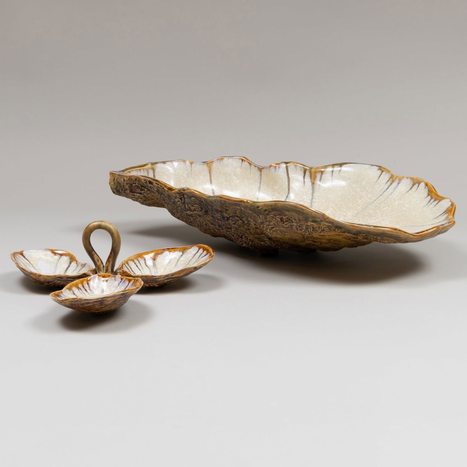 Two Majolica Oyster Shell Form Serving Pieces: Two Majolica Oyster Shell Form Serving Pieces Unmarked. The larger 5 1/2 x 22 x 14 3/4 in., the smaller 4 x 11 x 10 in. Property from a Williams Lawrence (Bunny Williams) Designed Interior