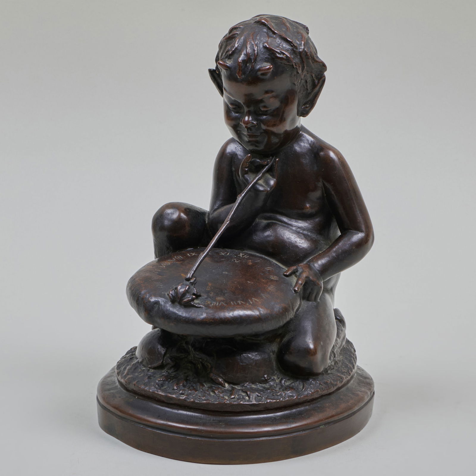 Jonathan Scott Hartley (1845-1912): Young Satyr with Frog: Jonathan Scott Hartley (1845-1912): Young Satyr with Frog Bronze, 1907, with the artist's copyright, dated with the Roman Bronze Works foundry mark at bottom. 9 1/2 x 7 x 7 in.