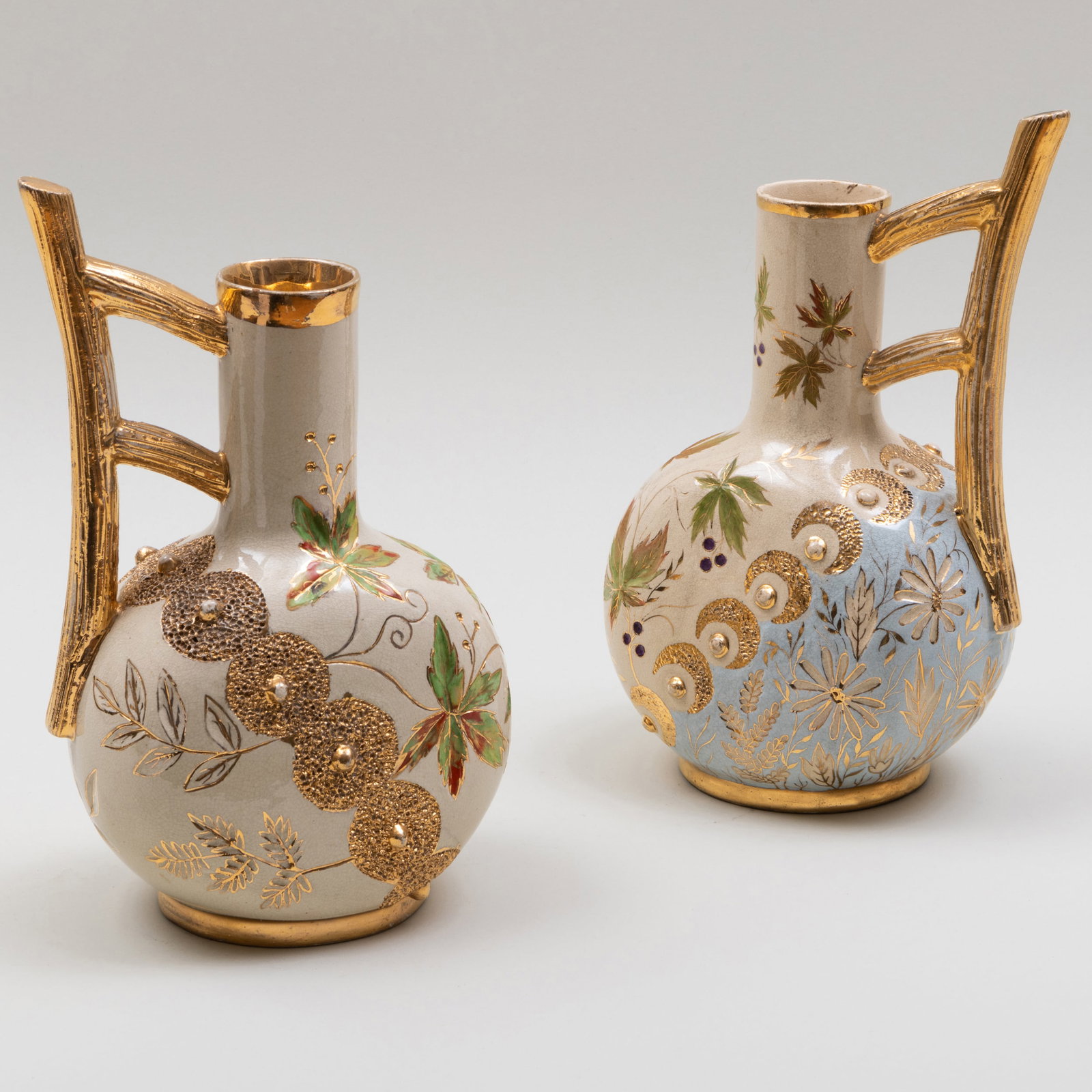Pair of Cincinnati Art Pottery 'Hungarian' Ewers: Pair of Cincinnati Art Pottery 'Hungarian' Ewers Gilt painted marks. 11 1/2 x 7 x 4 1/4 in.