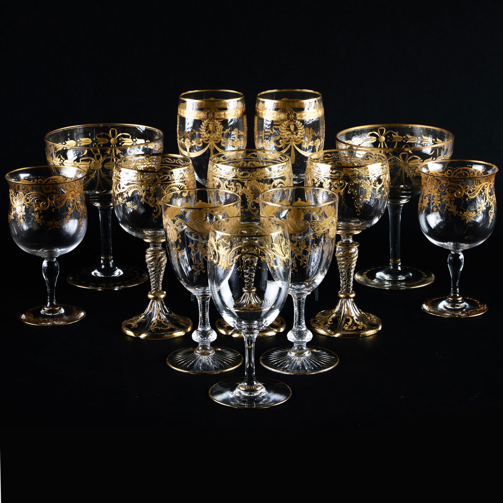 Assembled Set of Gilt Decorated Glass Stemware: Assembled Set of Gilt Decorated Glass Stemware Unmarked. Set of twenty-two goblets Set of sixteen wine glasses Set of six wine glasses with globular bowls Set of six small wine glasses Set of eight sm