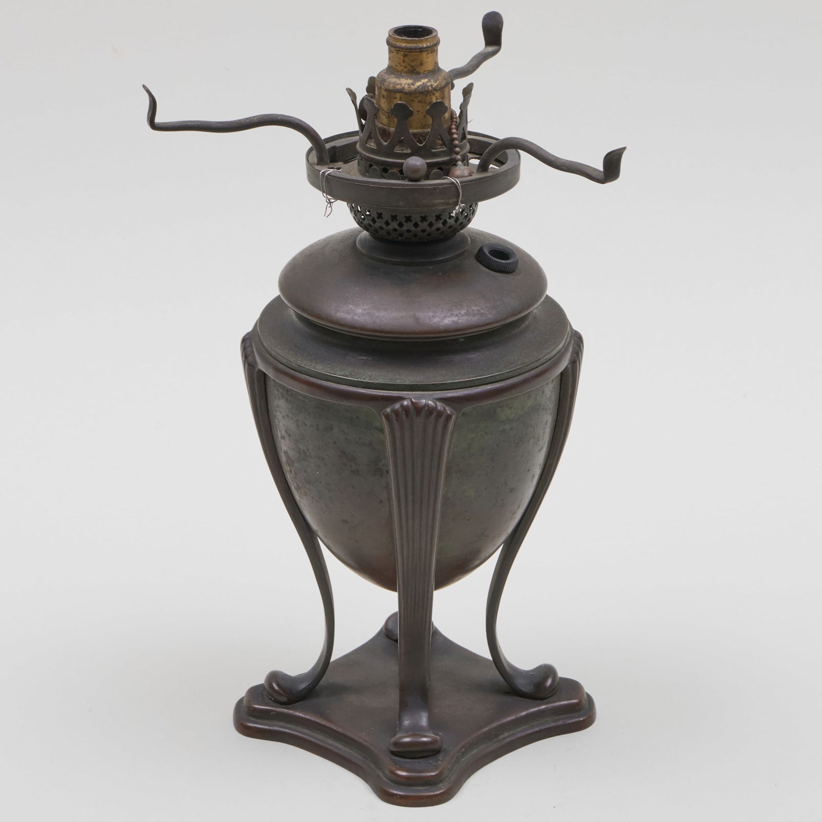 Tiffany Studios Patinated Bronze Lamp: Tiffany Studios Patinated Bronze Lamp Stamped 'Tiffany Studios New York D549' to the base of the oil font. 11 x 6 1/2 in. diam.