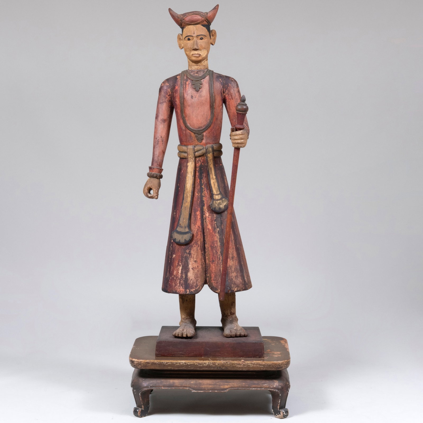 Polychromed Indonesian Figure and a Stand: Polychromed Indonesian Figure and a Stand The figure 58 x 17 1/2 x 14 in., the stand 9 3/4 x 17 3/4 x 26 1/2 in., 67 3/4 x 17 3/4 x 26 1/2 in. (overall).