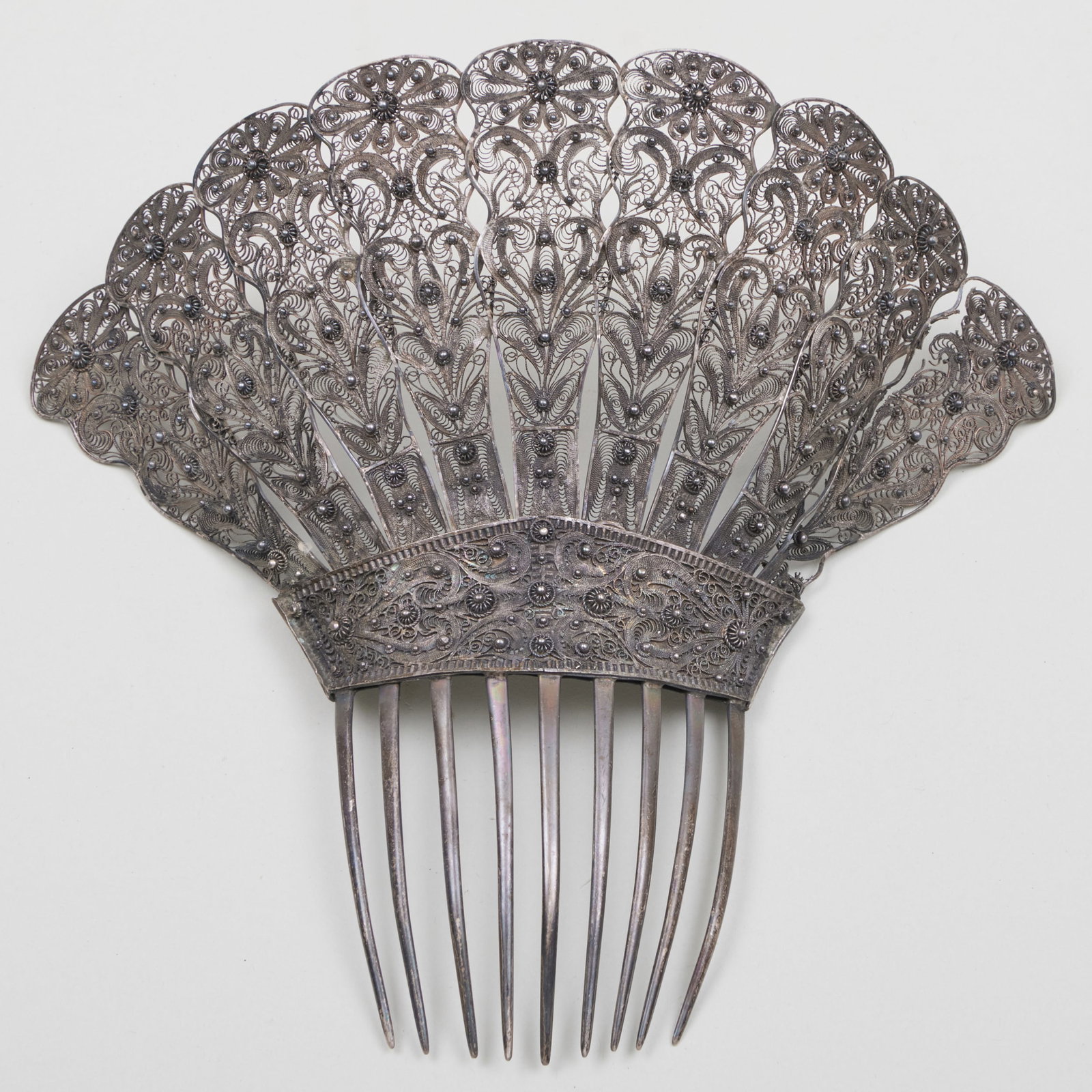 Scrolled Silver Haircomb: Scrolled Silver Haircomb Marked 'Sterling', monogrammed. 7 3/8 x 8 in., 4.9 oz approx. gross weight.
