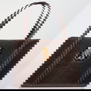 Martin Van Schaak Brown Lizard Skin Handbag: Martin Van Schaak Brown Lizard Skin Handbag Circa 1950. Featuring inset metal and enamel eagle embellishment, and double lizard straps. Approximate size: 7 1/4in. high; 10 1/4in. long; 3 3/4in. deep.