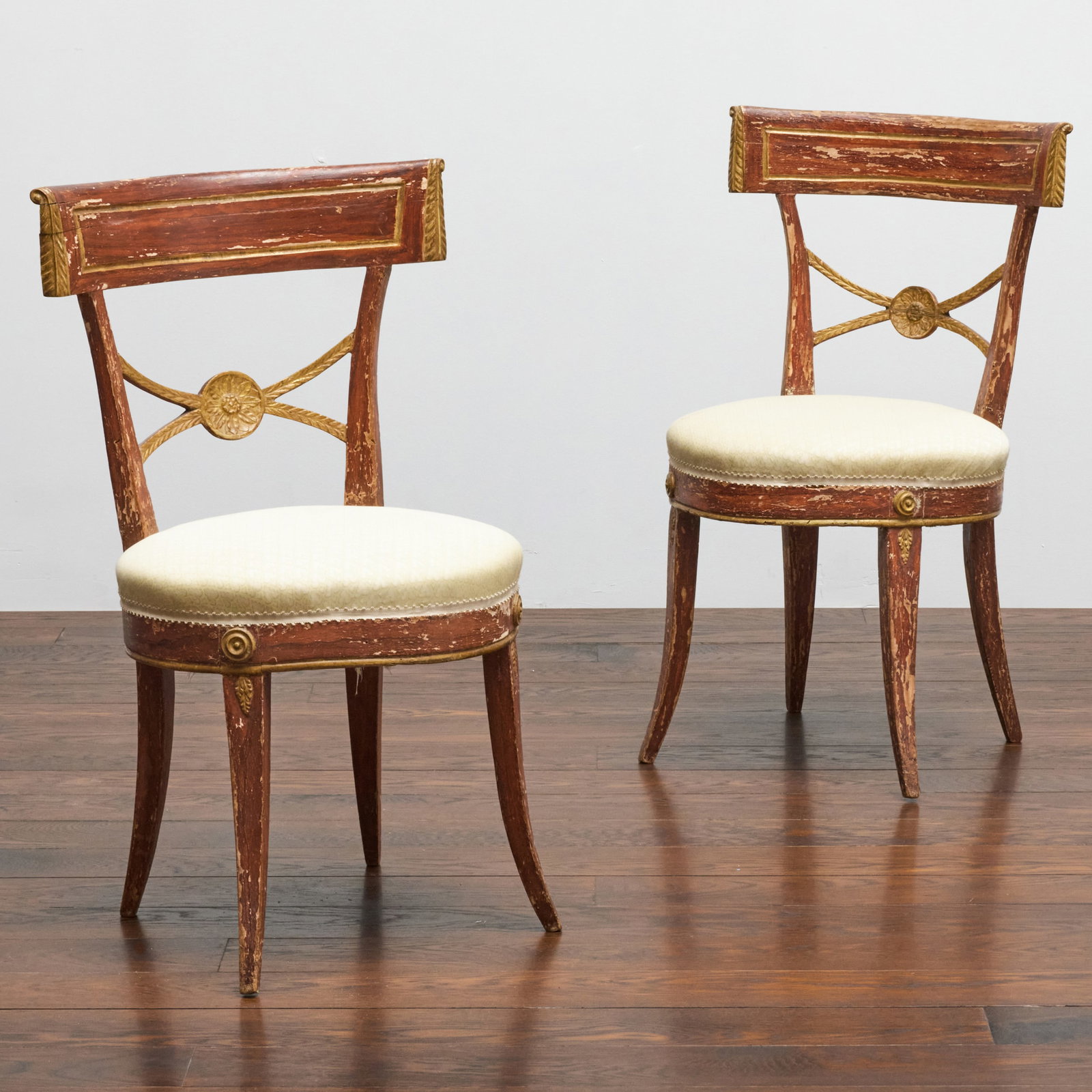 Pair of Italian Neoclassical Painted and Parcel-Gilt Side Chairs: Pair of Italian Neoclassical Painted and Parcel-Gilt Side Chairs 32 3/4 x 18 1/4 x 17 1/4 in., seat height 17 3/4 in. The Estate of Gail Jacobs.
