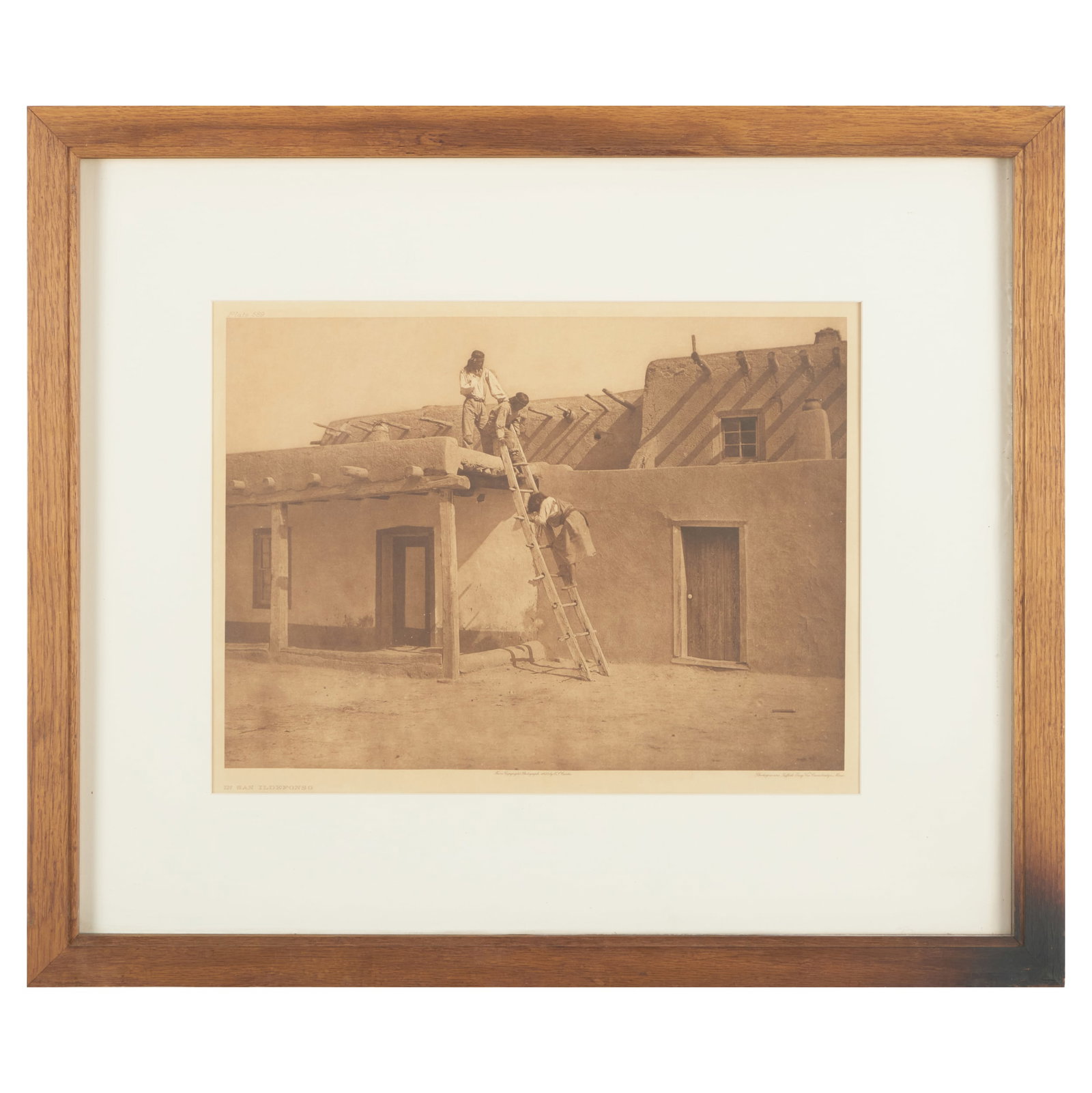 Edward Curtis (1868-1954): In San Idlefonso: Edward Curtis (1868-1954): In San Idlefonso Photogravure after the 1925 photograph, with label from Bronson-Rollins & Associates, Inc., LA. 17 3/4 x 21 1/2 in. (sheet), 22 x 26 in. (frame). The Collec