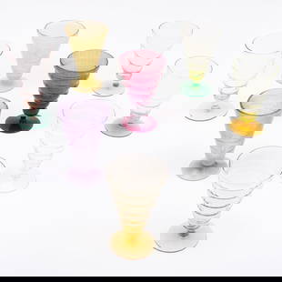 Group of Art Deco Glass Stemware: Group of Art Deco Glass StemwareUnmarked.Comprising:Twenty-two ribbed glasses in various colors and sizesSeven opaque yellow glassesFive opaque purple glassesThe largest 5 5/8 x 3 1/2 in. diam., (34