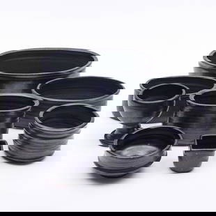 Assembled Set of Black Glazed Pottery Tableware: Assembled Set of Black Glazed Pottery TablewareVarious incised marks.Comprising:Eight gobletsSix small square cupsEight tea bowlsSix oval dishes in graduated sizesThe goblets 4 1/2 x 3 3/4 in. diam.,