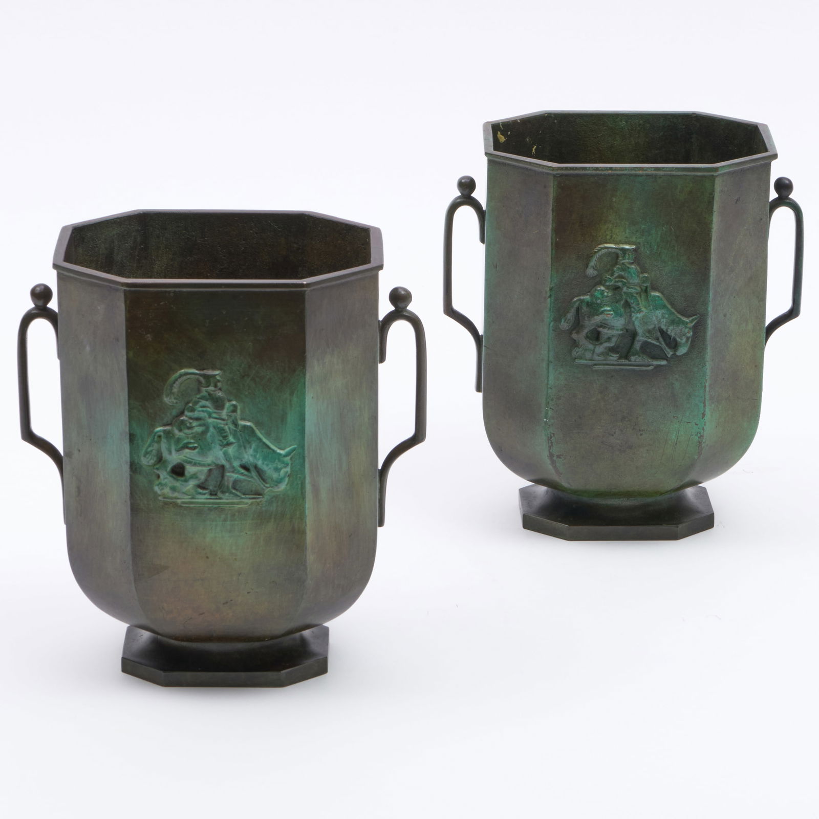 Pair of Swedish Patinated-Bronze Twin-Handled Vases, Stamped Jacob Angman for GAB: Pair of Swedish Patinated-Bronze Twin-Handled Vases, Stamped Jacob Angman for GAB Depicting Don Quixote in relief. 8 3/4 x 8 x 5 in. Sold Christie's, South Kensington, August 5, 2008, Lot 309. The Col