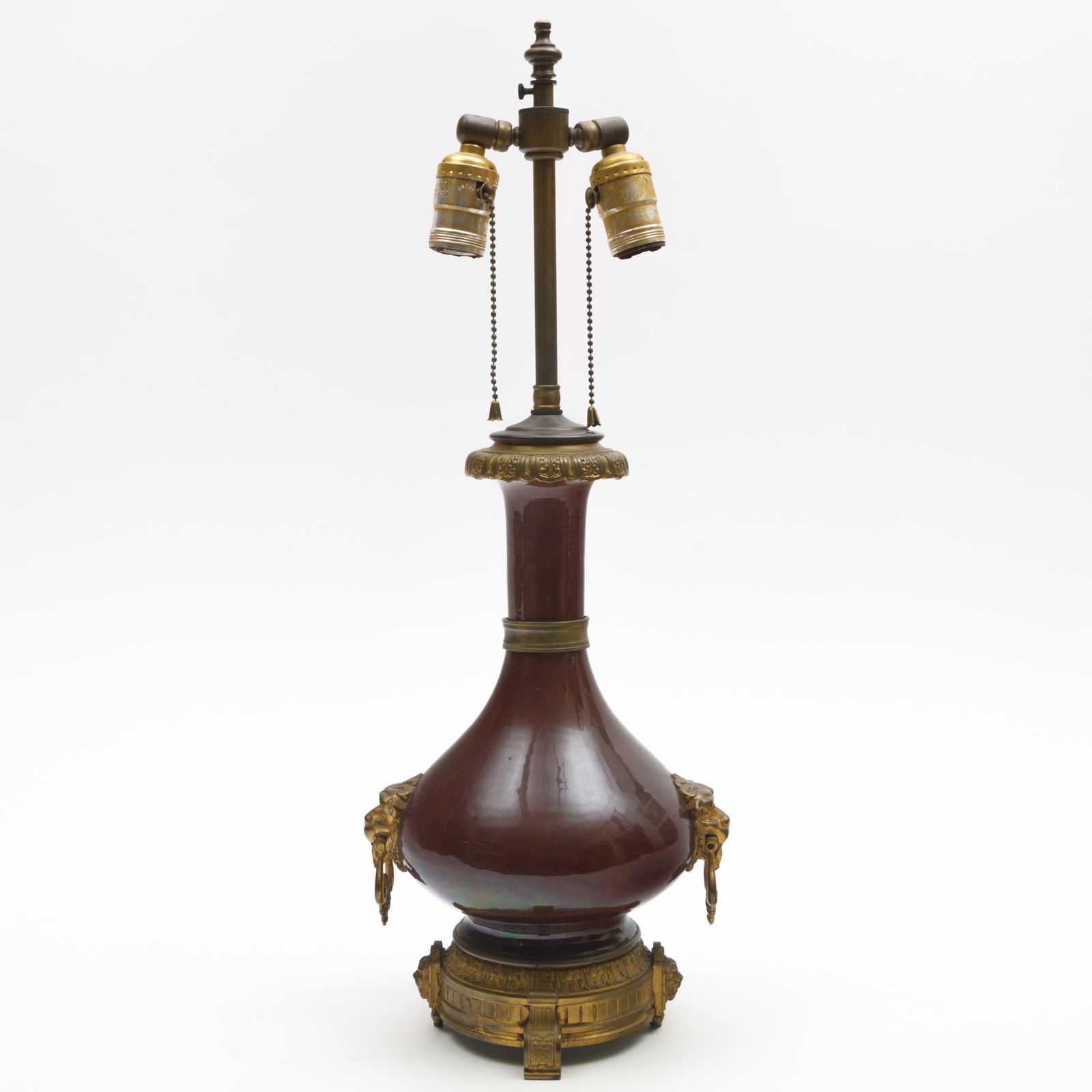 Gilt-Metal-Mounted Chinese Copper Red Porcelain Vase Mounted as a Lamp: Gilt-Metal-Mounted Chinese Copper Red Porcelain Vase Mounted as a Lamp The vase 13 x 7 in. diam., 20 x 7 1/2 x 7 in. (to socket). Property of an Upper East Side Collector