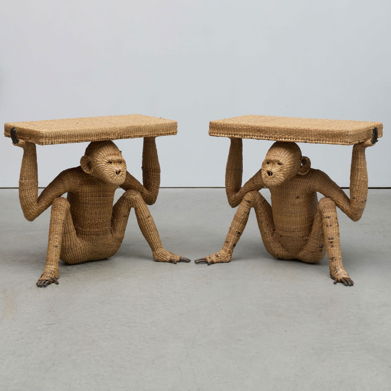 Pair of Metal and Woven Seagrass Monkey Form Console Tables: Pair of Metal and Woven Seagrass Monkey Form Console Tables 32 1/2 x 40 x 23 in. Collection of Jordan Saunders.