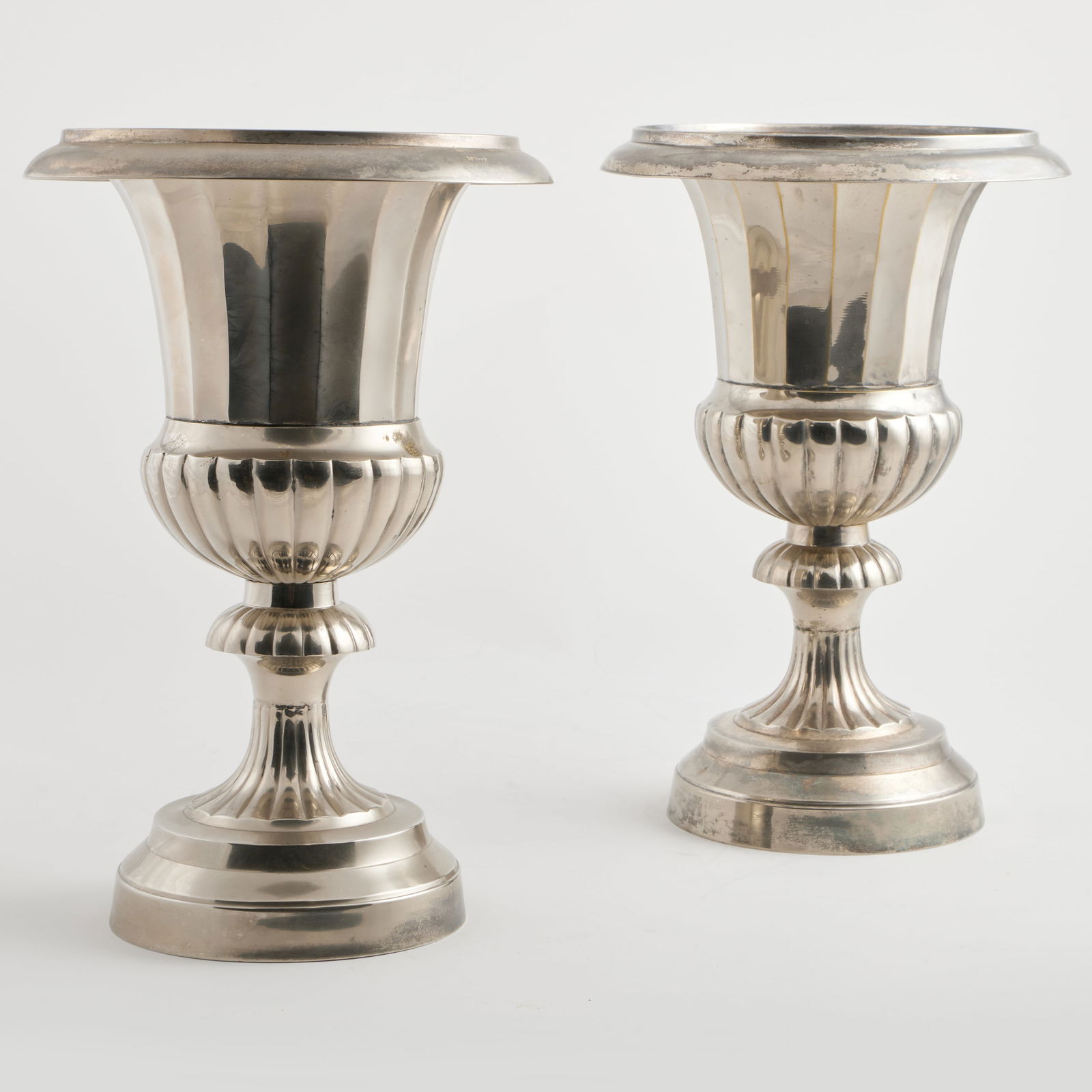 Pair of Silvered Metal Campagna Urns: Pair of Silvered Metal Campagna Urns 14 1/4 x 9 1/2 in. diam. Collection of Jordan Saunders.