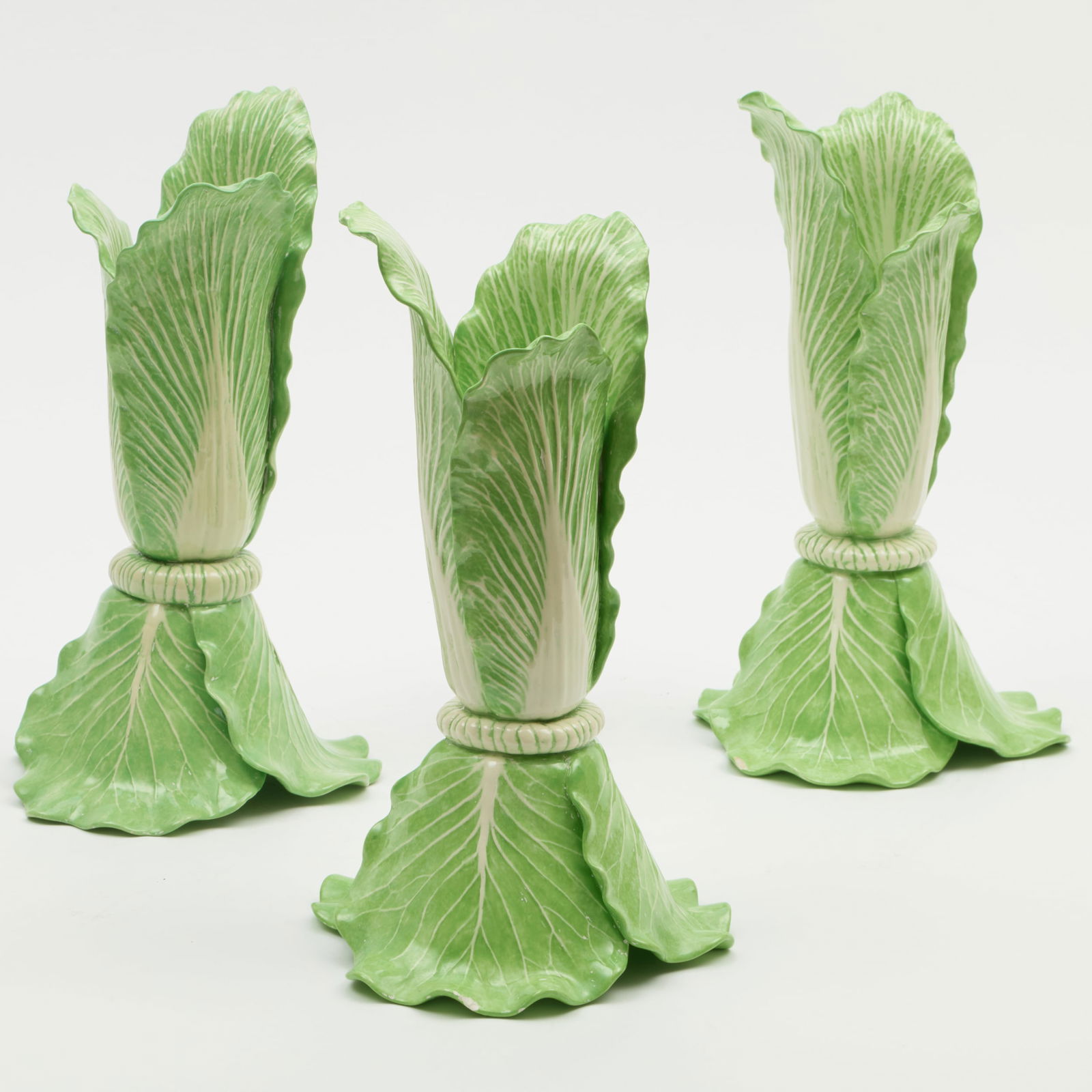 Group of Three Dodie Thayer Porcelain Lettuce Form Candlesticks: Group of Three Dodie Thayer Porcelain Lettuce Form Candlesticks Incised mark. 11 1/2 x 6 in. diam. The Collection of Carole Harris.