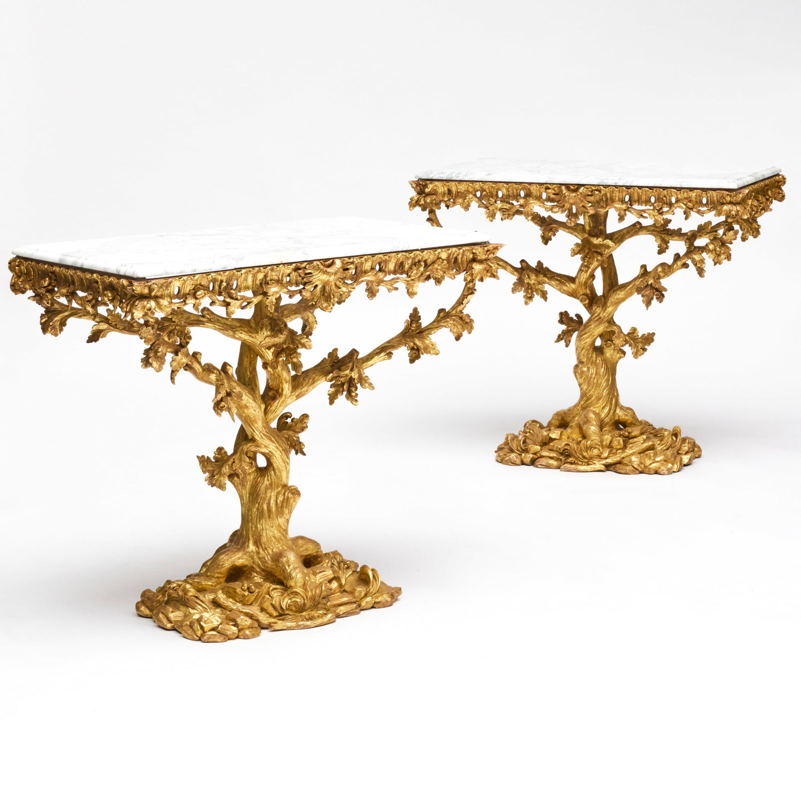 Pair of George II Style Giltwood Tree-Form Console Tables with Marble Tops, In the Manner of Thomas: Pair of George II Style Giltwood Tree-Form Console Tables with Marble Tops, In the Manner of Thomas Johnson 33 x 38 x 22 1/4 in. With John Hobbs, London Sold Sotheby's, New York, October 17, 2015, Lot
