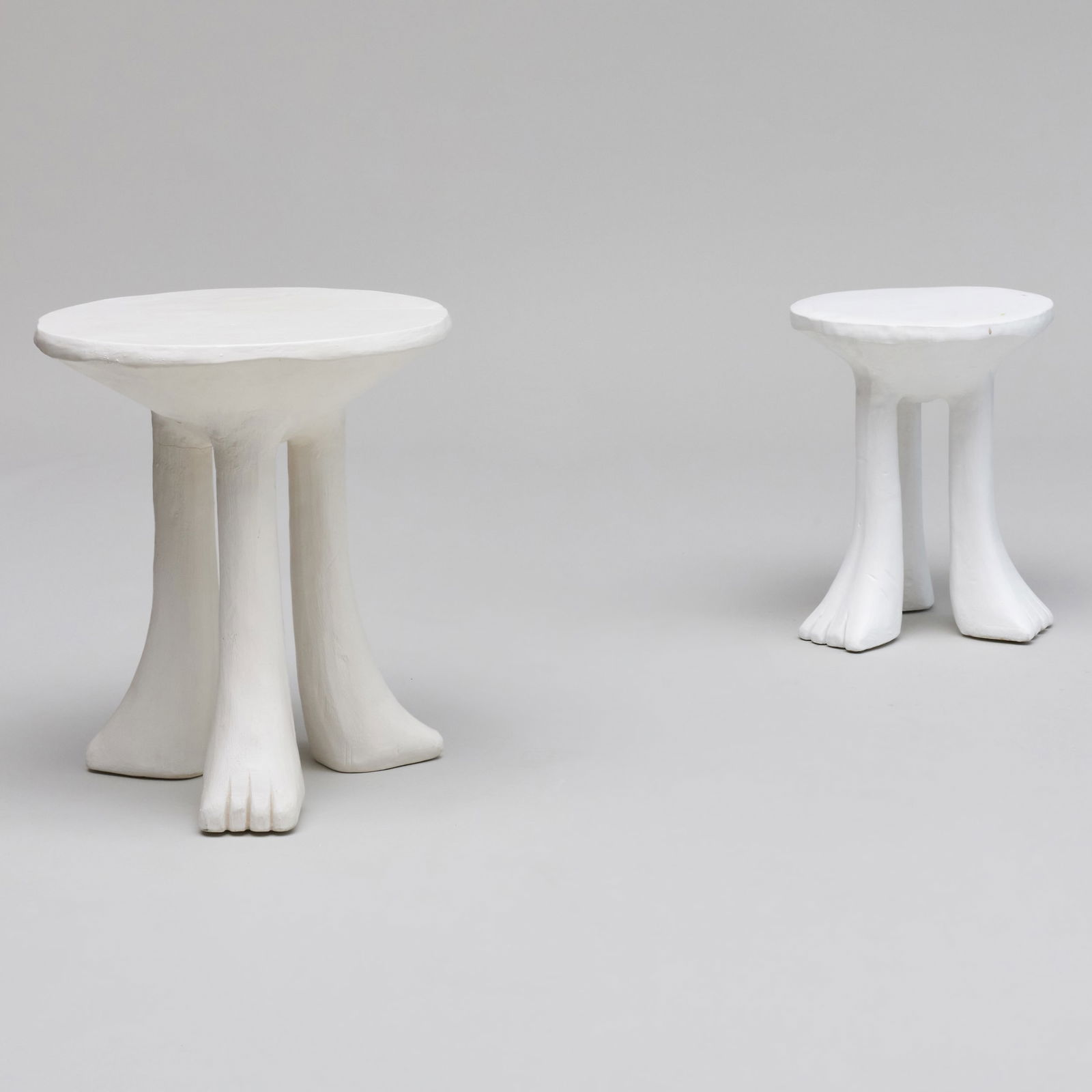 Two John Dickinson White Plaster African Tables: Two John Dickinson White Plaster African Tables Signed John Dickinson, San Francisco. 20 1/2 X 18 X 17 1/2 in. 26 x 22 1/4 x 21 1/2 in. The Collection of Carole Harris.