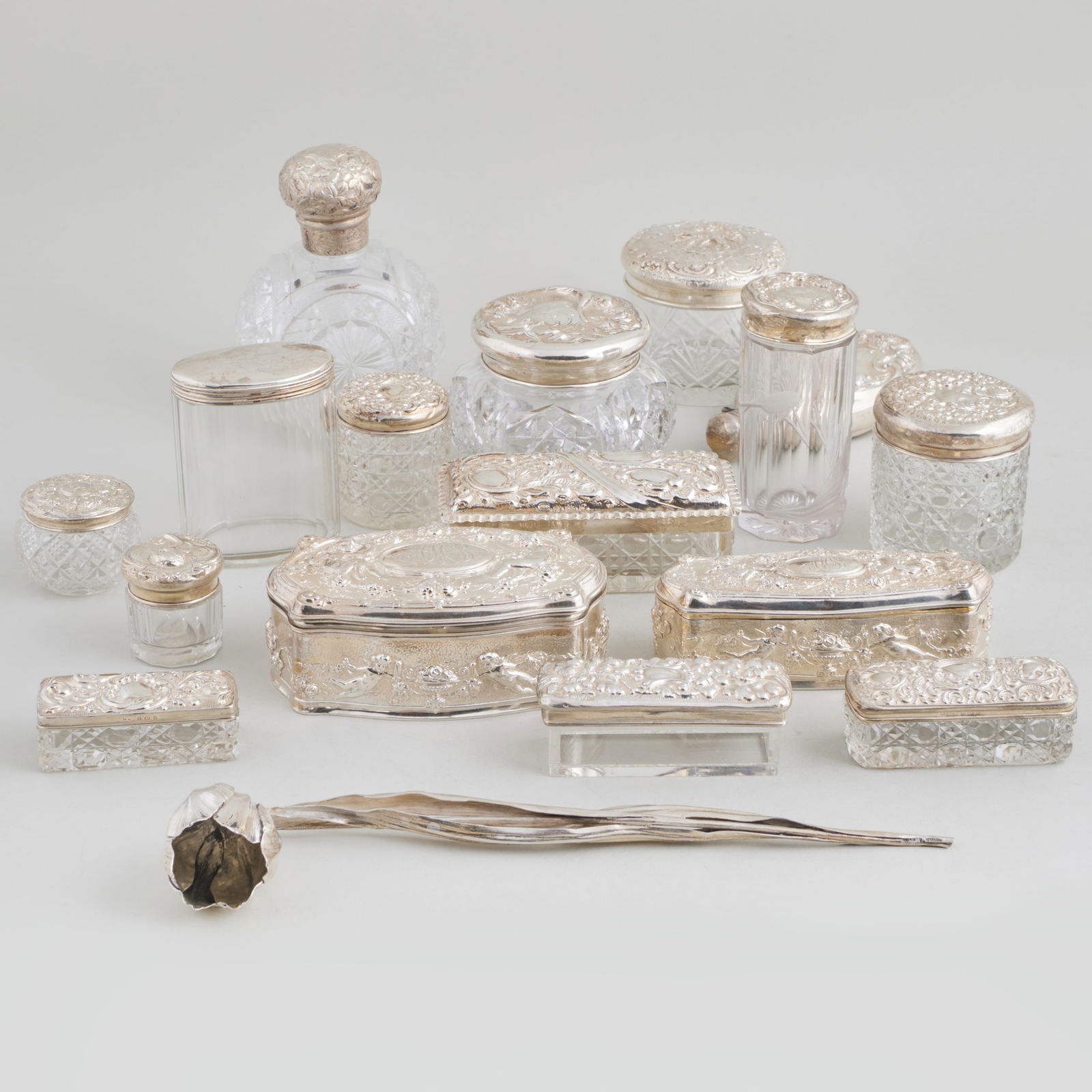 Group of Silver Dressing Wares and a Buccellati Tulip Table Ornament: Group of Silver Dressing Wares and a Buccellati Tulip Table Ornament Comprising: Two Gorham silver repousse boxes and covers, marked 'Sterling', monogrammed An American silver perfume flask, marked 'S