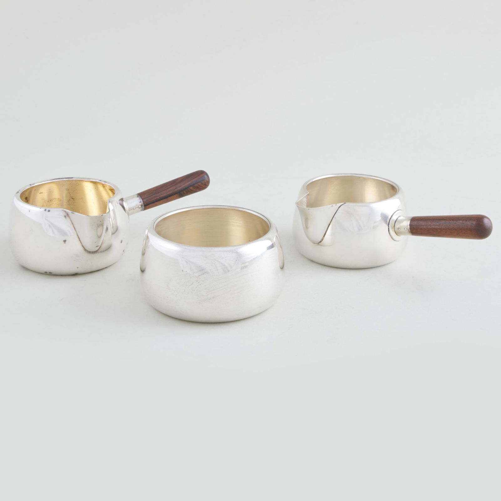 Pair of Anton Michelsen Brandy Pans and a Bowl: Pair of Anton Michelsen Brandy Pans and a Bowl Marked 'Sterling'. The pans 2 x 6 x 3 1/2 in., the bowl 2 x 3 1/2 in., 11.8 oz. approx. gross weight. Collection of Jan Mitchell.