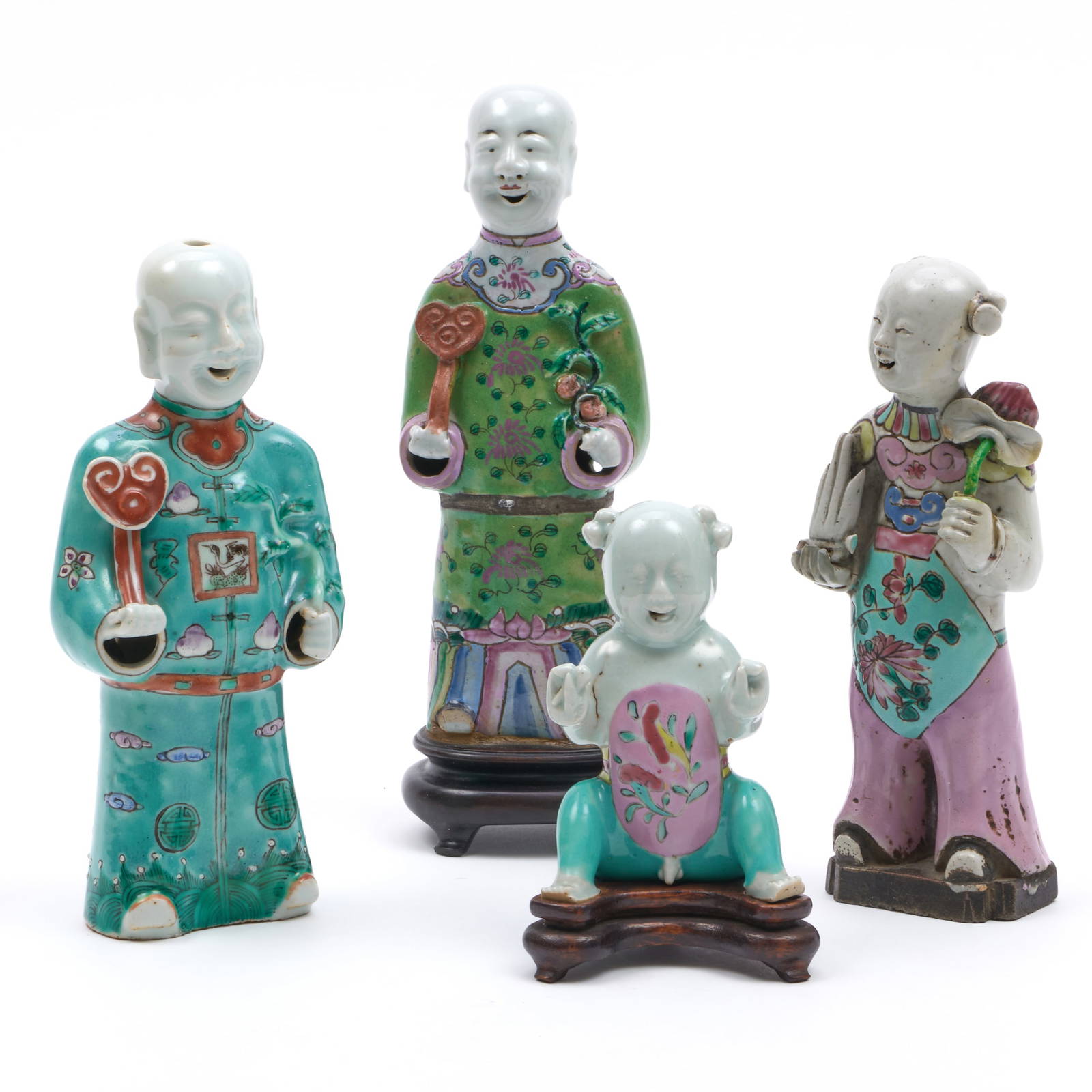 Group of Four Chinese Porcelain Figures of Laughing Boys