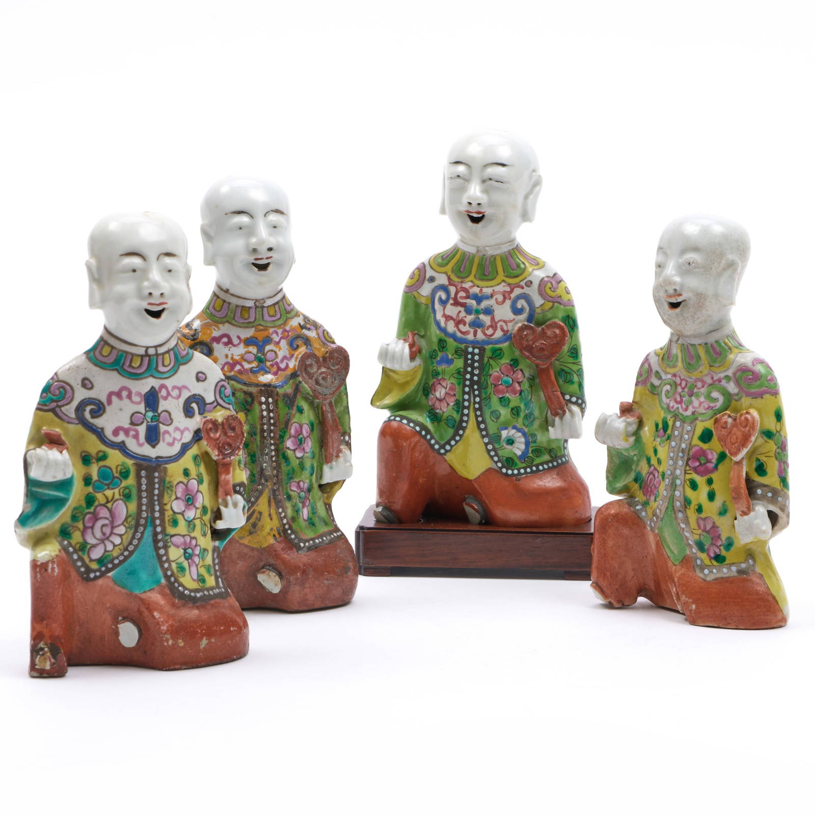 Group of Four Chinese Famille Rose Porcelain Figures of Laughing Boys