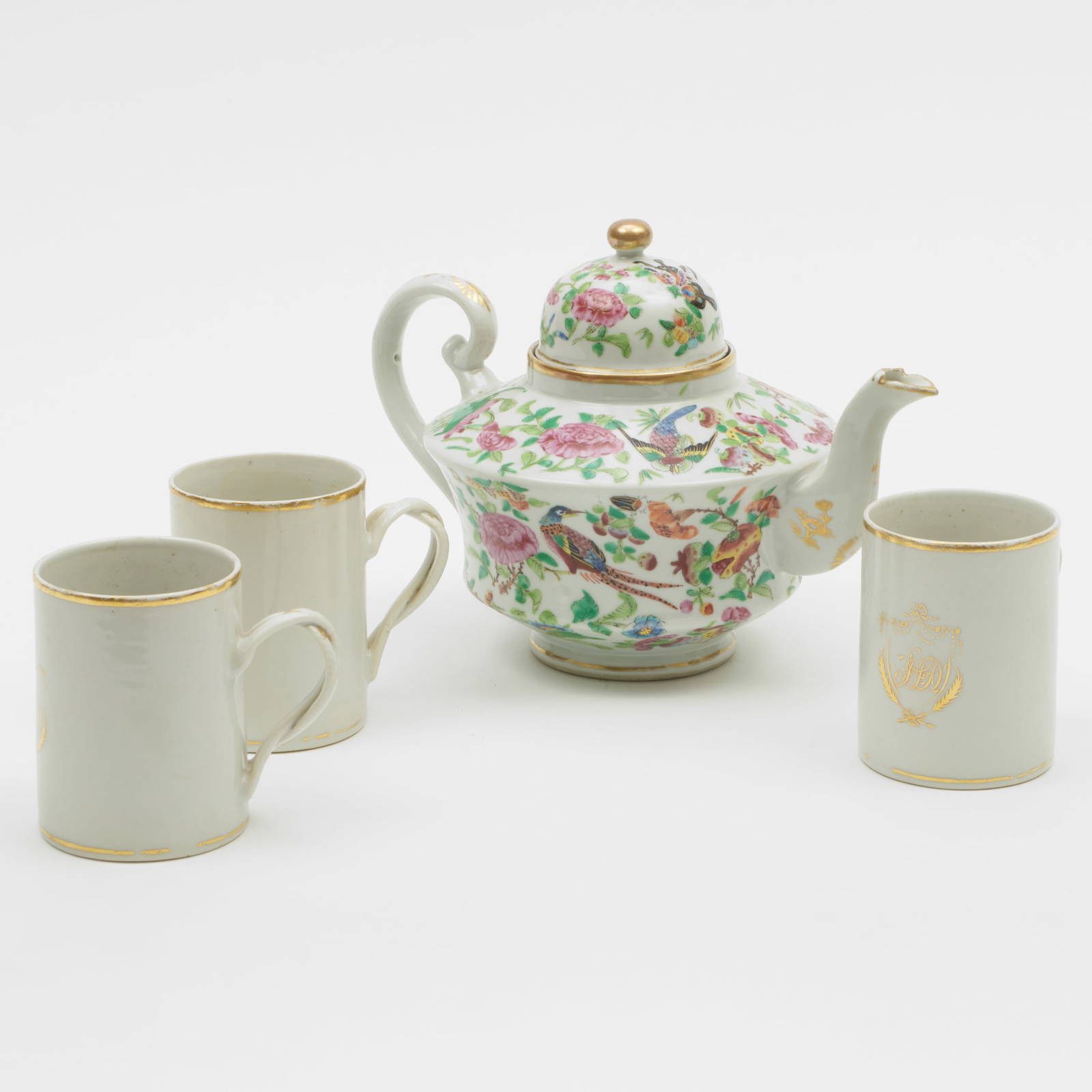 Chinese Export Famille Rose Porcelain Teapot and Cover and Three Gilt Monogrammed Mugs