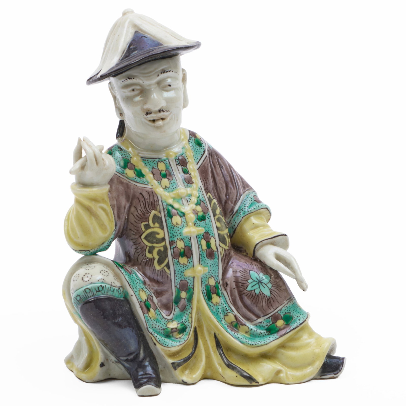 Chinese Yellow, Green and Aubergine Glazed Seated Figure: Chinese Yellow, Green and Aubergine Glazed Seated Figure Unmarked. 6 1/4 x 4 3/4 x 2 1/4 in. The Collection of James M. Labaugh Antiques, Pound Ridge, NY.