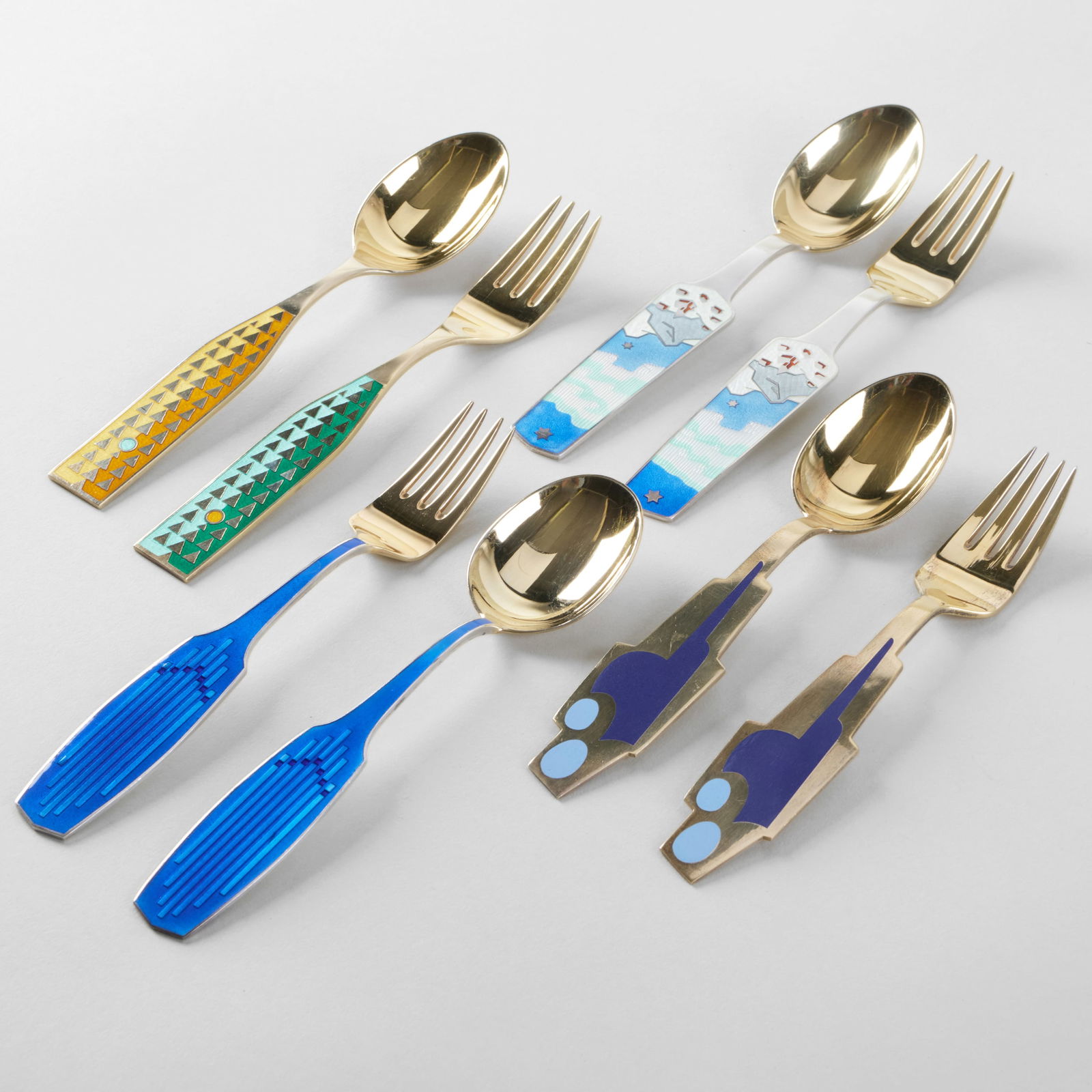 Set of Eight Jensen Silver and Enamel Commemorative Holiday Forks and Spoons: Set of Eight Jensen Silver and Enamel Commemorative Holiday Forks and Spoons Comprising: 1960 'Winter Solstice' spoon and fork, designed by Rolf Middelboe, mark of A. Michelsen and 'Sterling' 1961 'Or